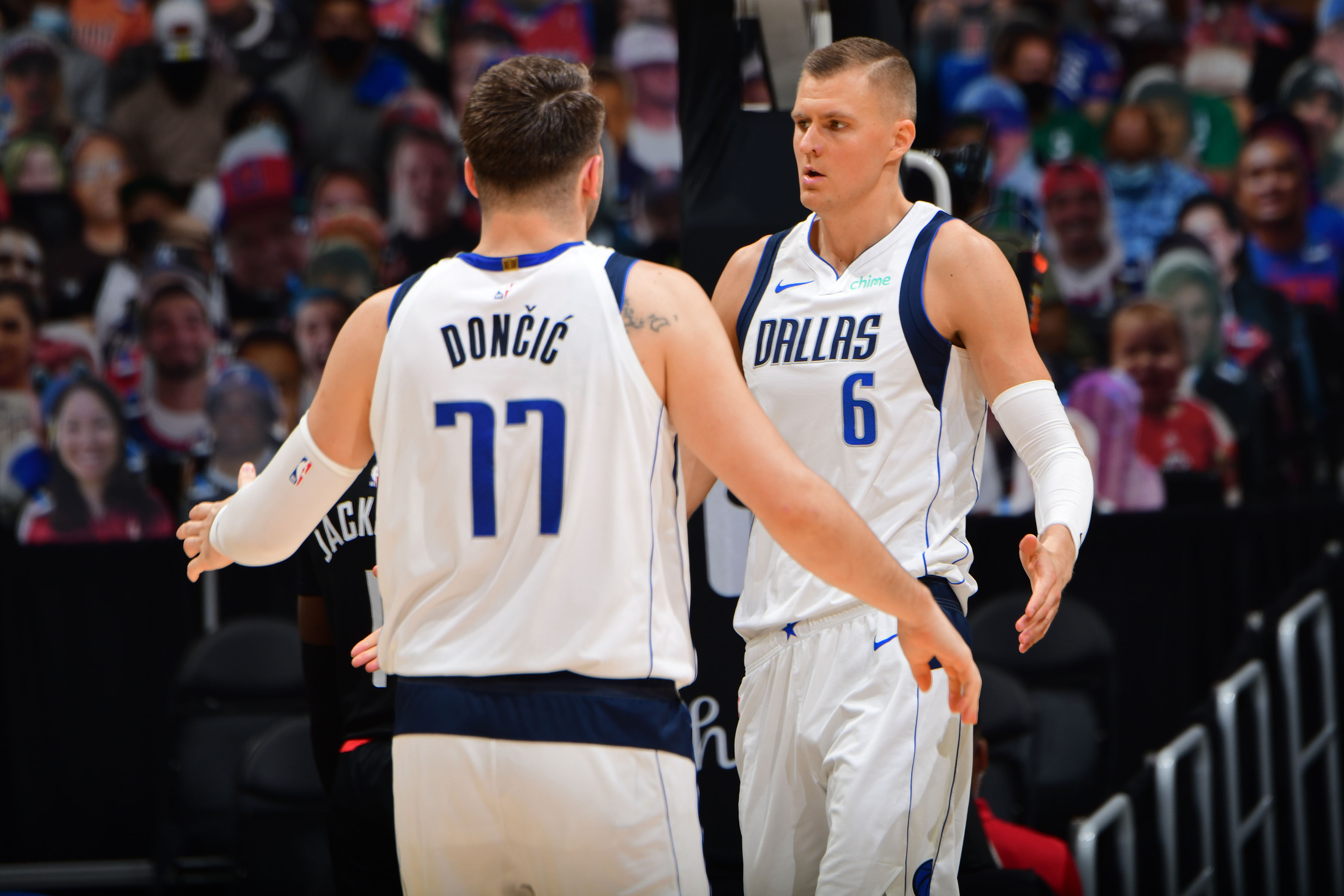 LOS ANGELES, CA - MAY 25: Luka Doncic #77 and Kristaps Porzingis #6 of the Dallas Mavericks hi-five during the game against the LA Clippers during Round 1, Game 2 of the 2021 NBA Playoffs on May 25, 2021 at STAPLES Center in Los Angeles, California. NOTE TO USER: User expressly acknowledges and agrees that, by downloading and/or using this Photograph, user is consenting to the terms and conditions of the Getty Images License Agreement. Mandatory Copyright Notice: Copyright 2021 NBAE (Photo by Adam Pantozzi/NBAE via Getty Images)