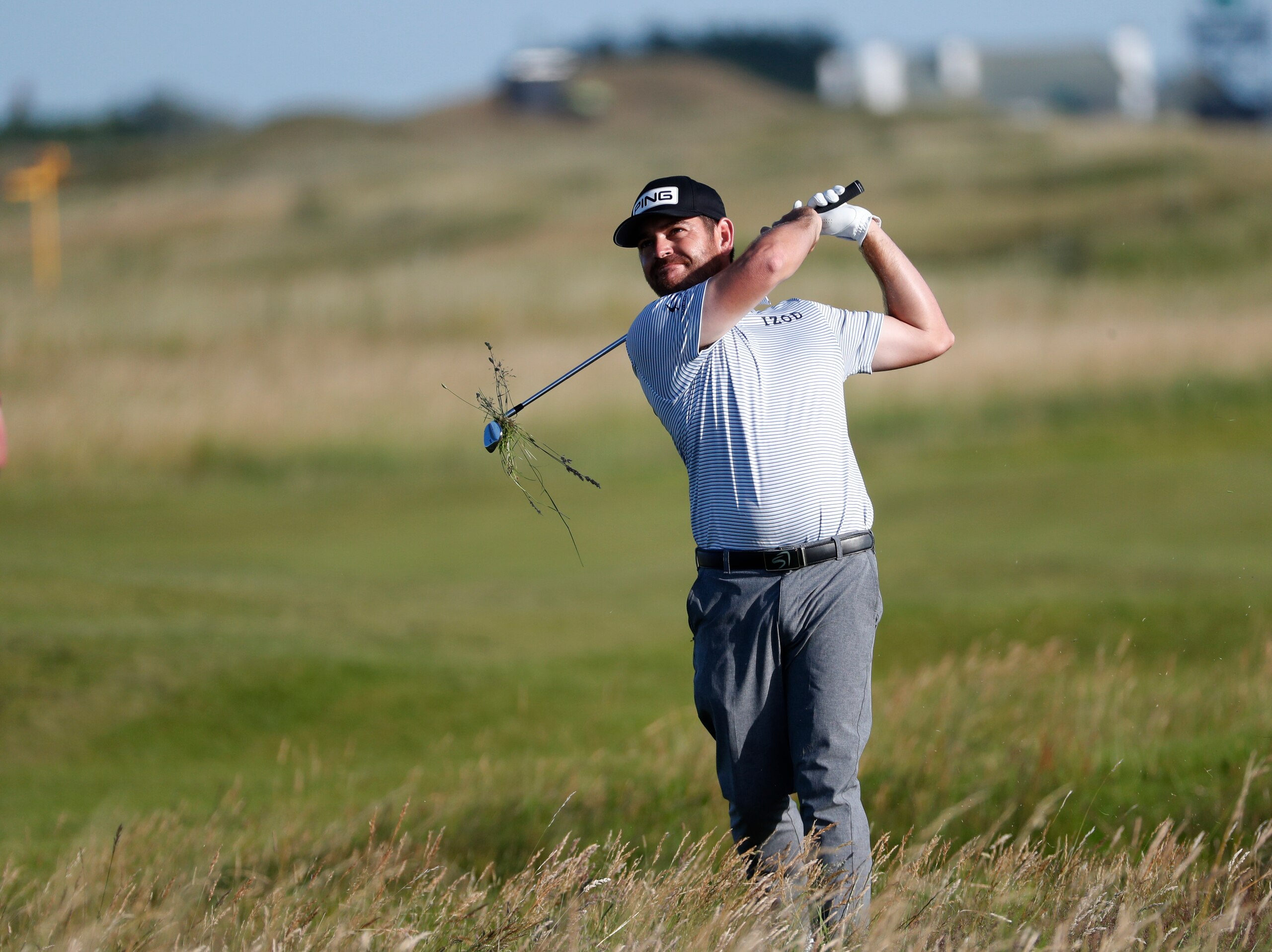 South Africa's Louis Oosthuizen plays out of the rough on the 13th hole during the third round of the British Open Golf Championship at Royal St George's golf course Sandwich, England, Saturday, July 17, 2021. (AP Photo/Peter Morrison)
