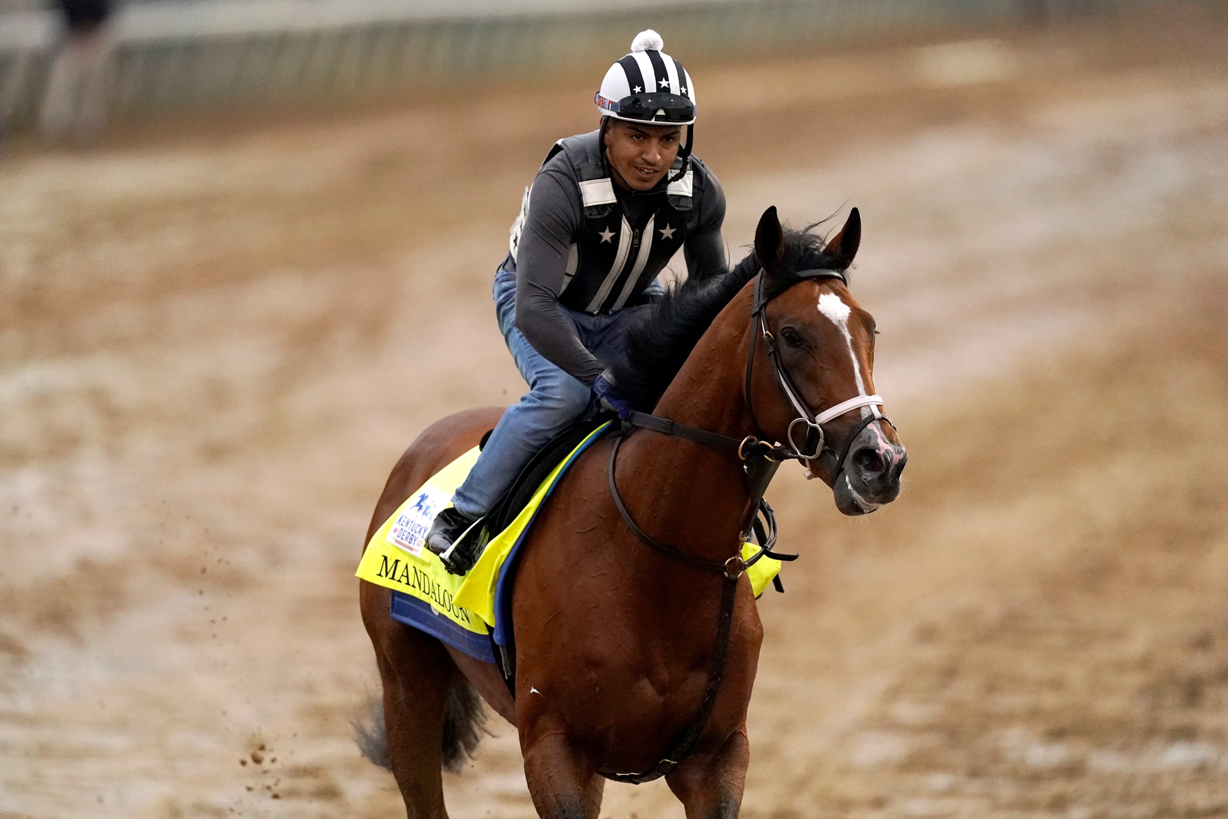 Kentucky Derby entrant Mandaloun works out at Churchill Downs Thursday, April 29, 2021, in Louisville, Ky. The 147th running of the Kentucky Derby is scheduled for Saturday, May 1. (AP Photo/Charlie Riedel)