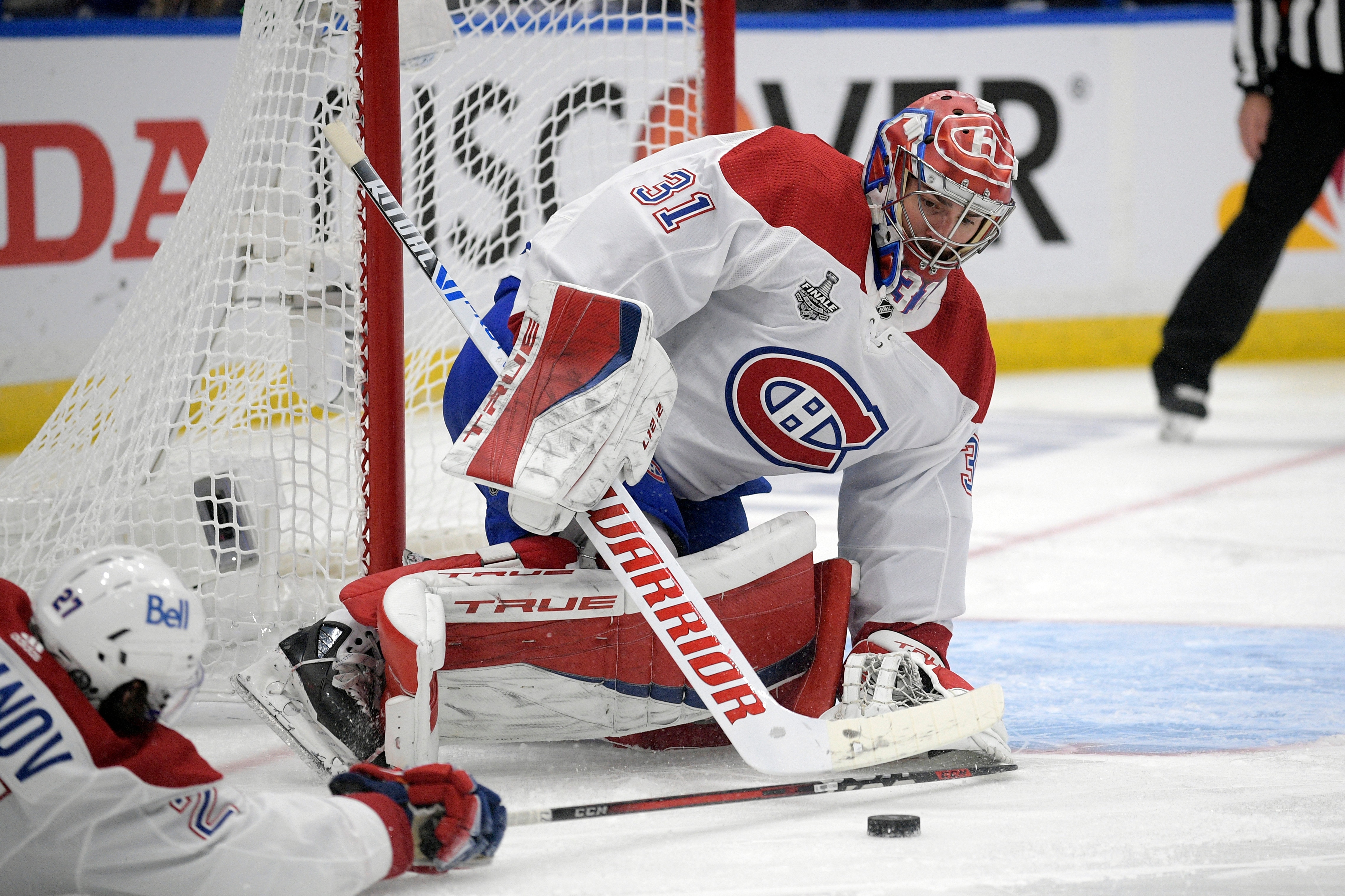 Montreal Canadiens goaltender Carey Price (31) plays the puck during the first period in Game 5 of the NHL hockey Stanley Cup finals against the Tampa Bay Lightning, Wednesday, July 7, 2021, in Tampa, Fla. (AP Photo/Phelan Ebenhack)