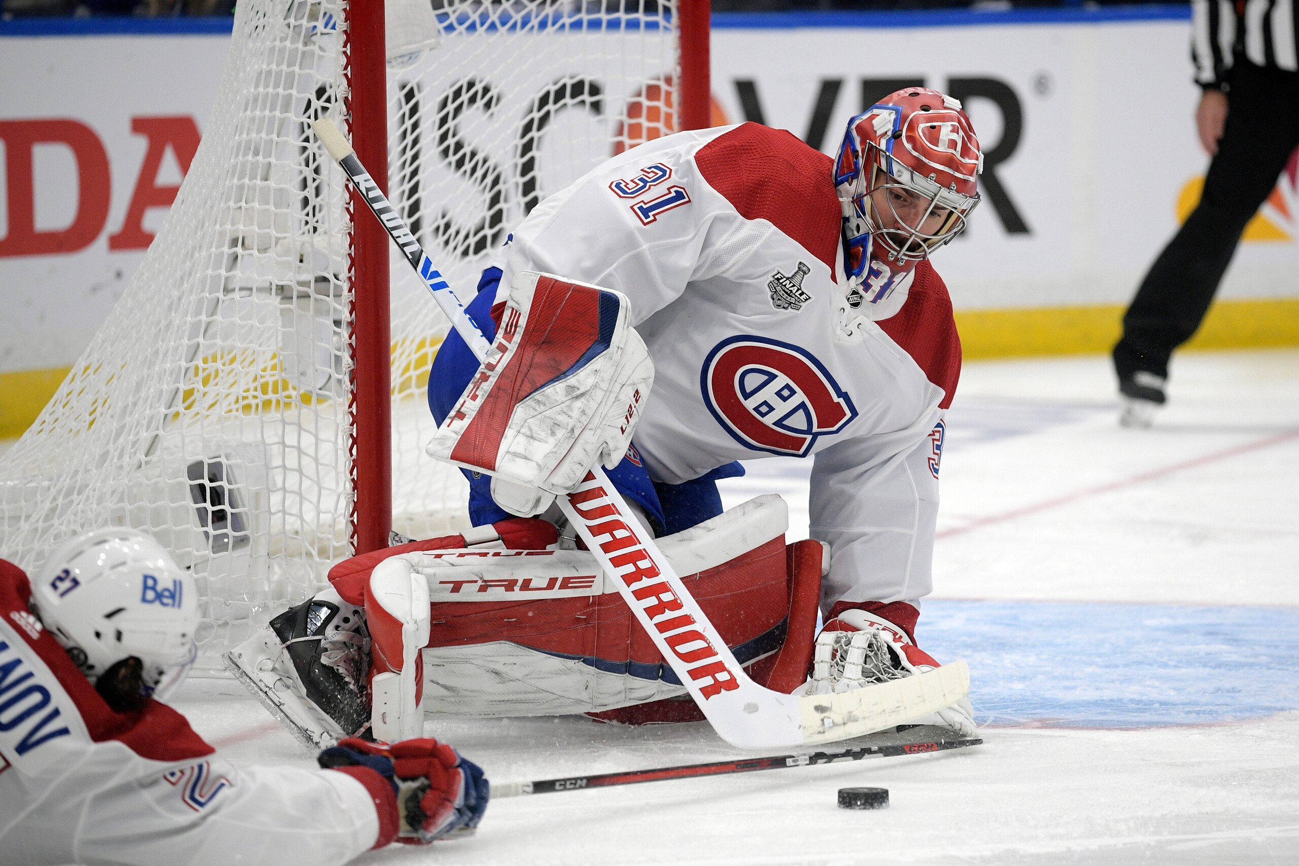 Montreal Canadiens goaltender Carey Price (31) plays the puck during the first period in Game 5 of the NHL hockey Stanley Cup finals against the Tampa Bay Lightning, Wednesday, July 7, 2021, in Tampa, Fla. (AP Photo/Phelan Ebenhack)