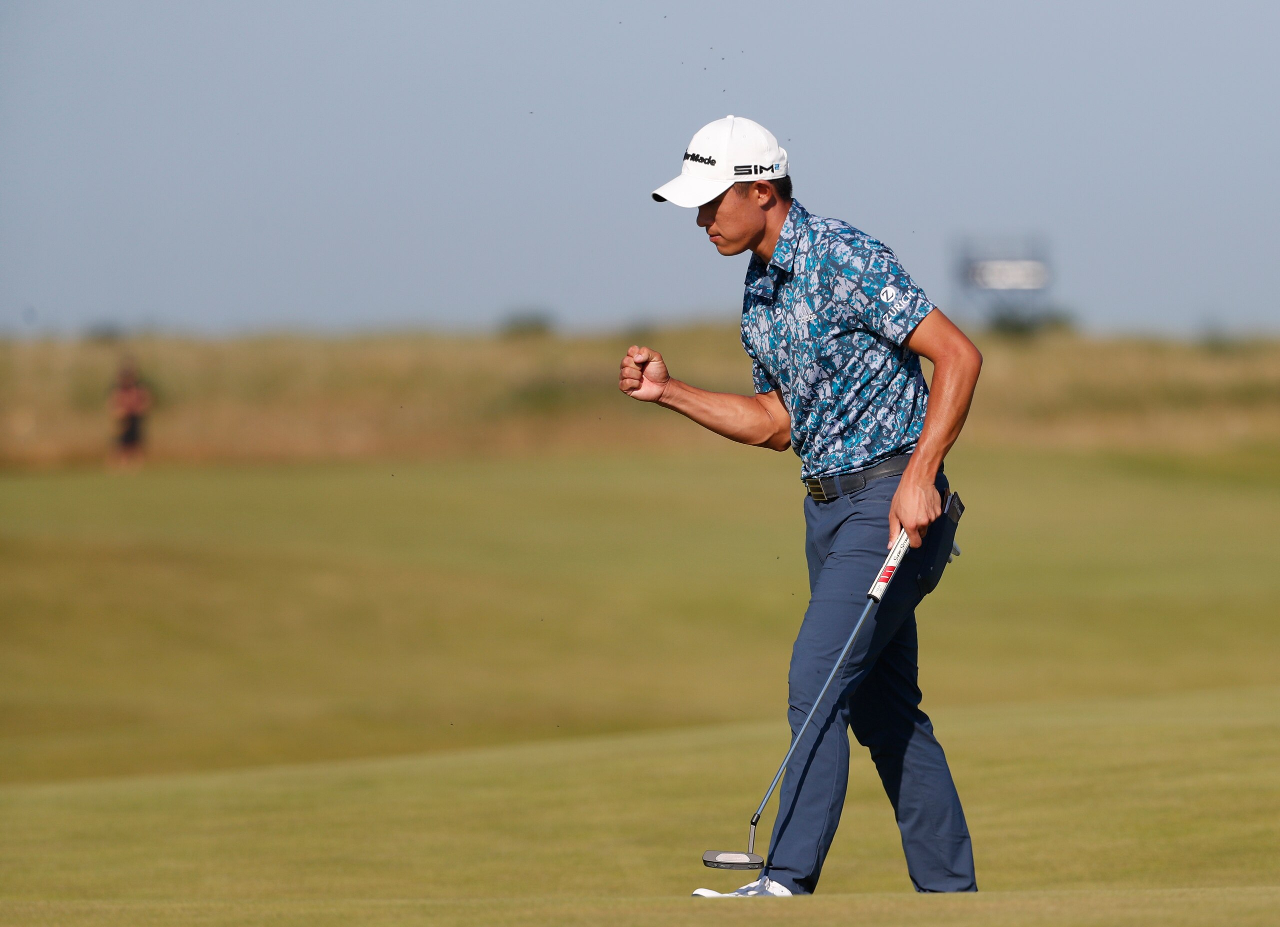 United States' Collin Morikawa celebrates after a birdie putt on the 14th hole during the final round of the British Open Golf Championship at Royal St George's golf course Sandwich, England, Sunday, July 18, 2021. (AP Photo/Peter Morrison)