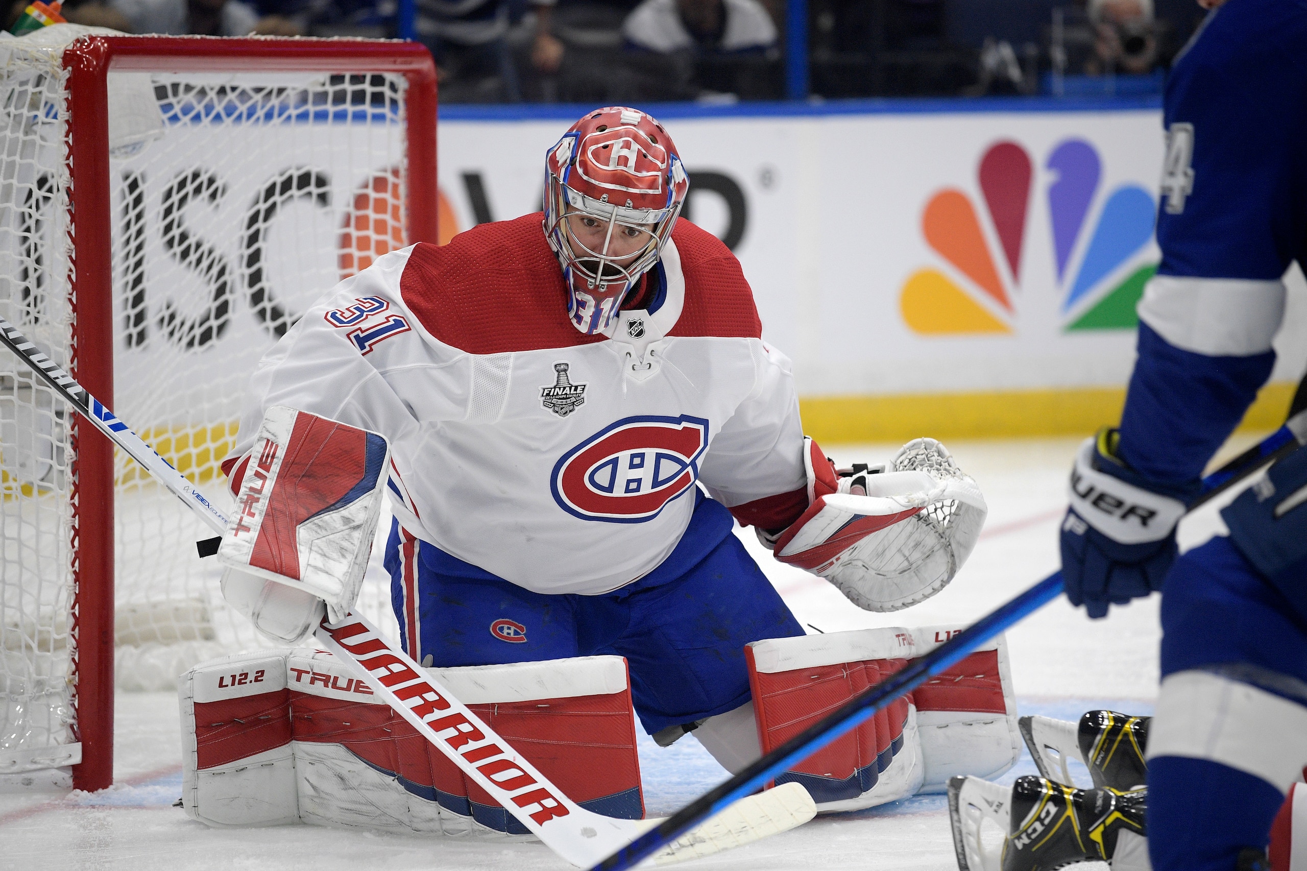 Montreal Canadiens goaltender Carey Price (31) blocks a shot by Tampa Bay Lightning left wing Pat Maroon, right, during the second period of Game 5 of the NHL hockey Stanley Cup finals series, Wednesday, July 7, 2021, in Tampa, Fla. (AP Photo/Phelan M. Ebenhack)