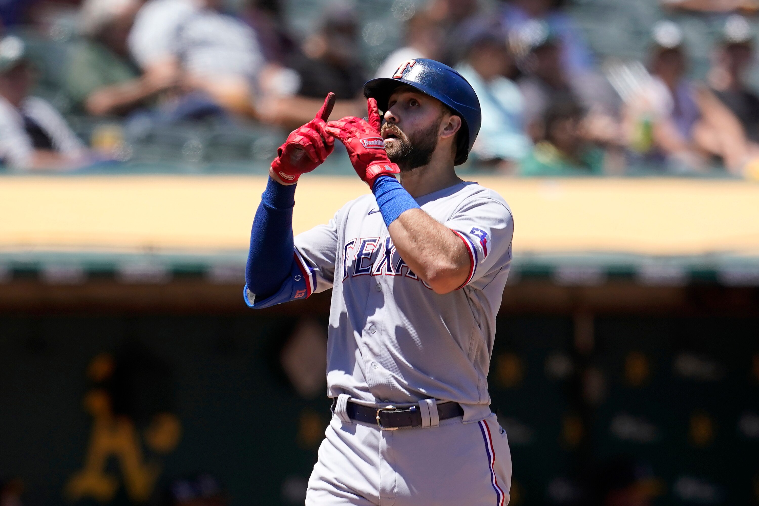 Texas Rangers' Joey Gallo gestures after hitting a two-run home run during the fifth inning of a baseball game against the Oakland Athletics in Oakland, Calif., Thursday, July 1, 2021. (AP Photo/Jeff Chiu)