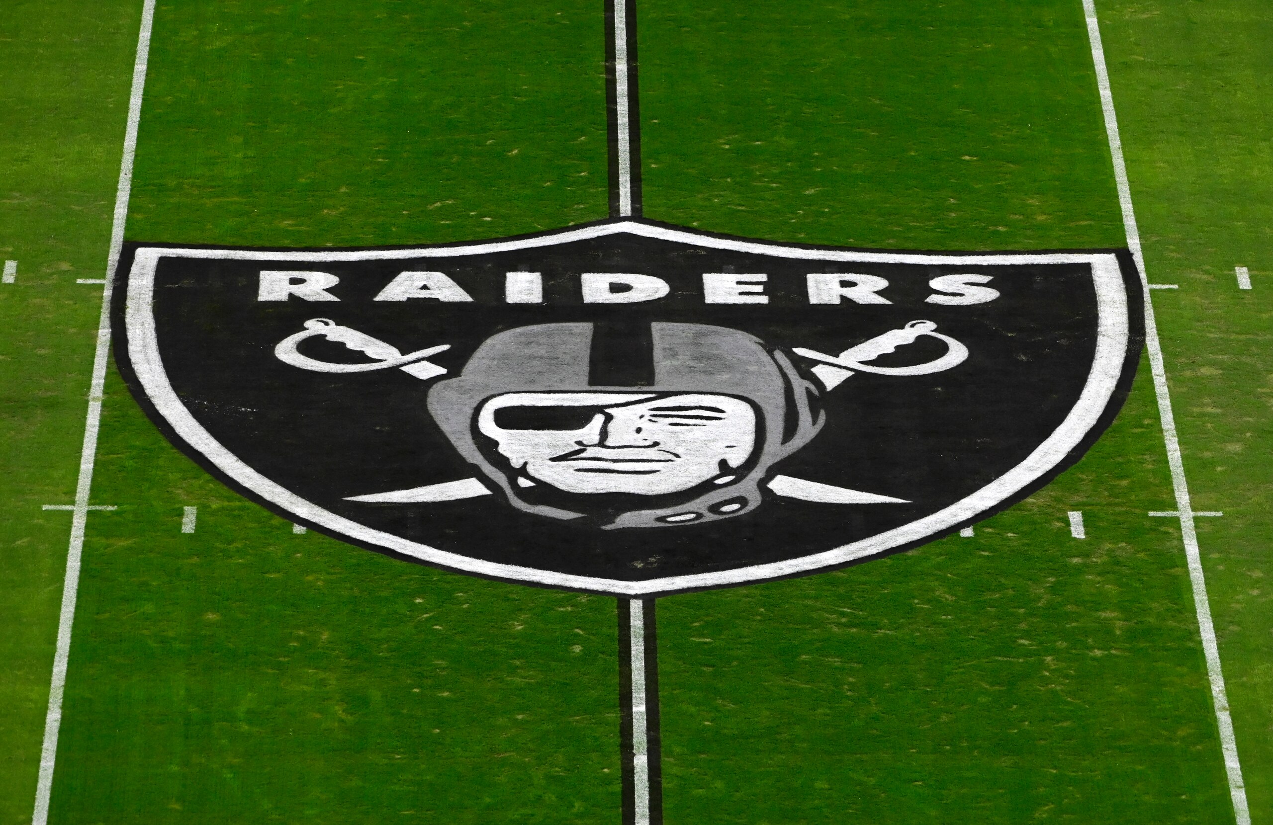 The Las Vegas Raiders logo is seen on the playing field prior to an NFL football game between the Las Vegas Raiders and the Kansas City Chiefs, Sunday, Nov. 22, 2020, in Las Vegas. (AP Photo/David Becker) The Las Vegas Raiders logo is seen on the playing field prior to an NFL football game between the Las Vegas Raiders and the Kansas City Chiefs, Sunday, Nov. 22, 2020, in Las Vegas. (AP Photo/David Becker)