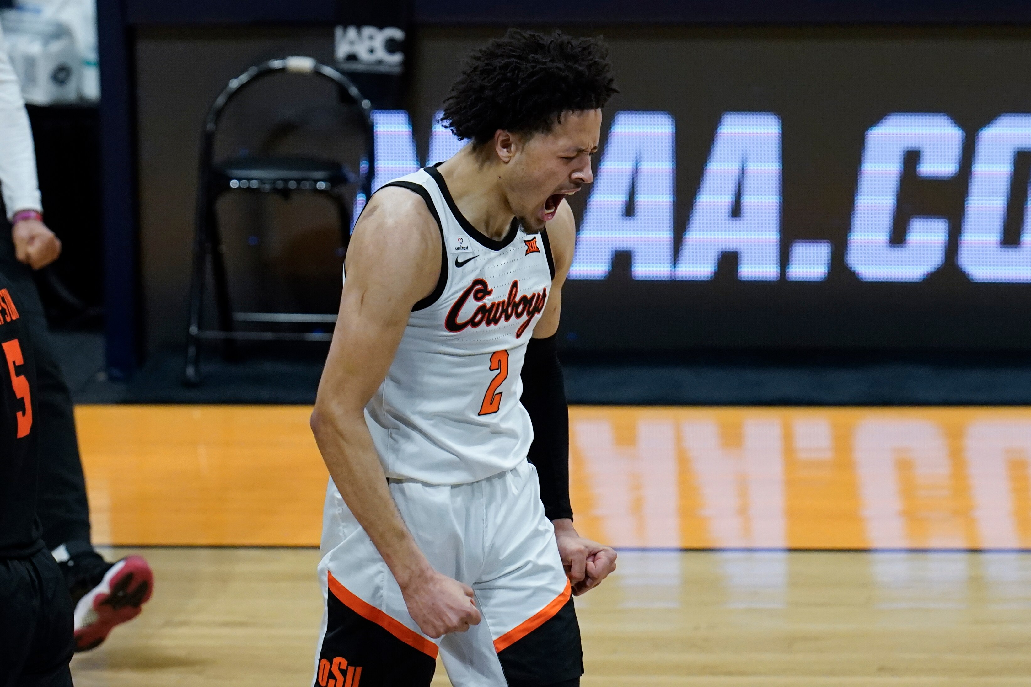 Oklahoma State guard Cade Cunningham (2) reacts to hitting a three-point basket against Oregon State during the second half of a men's college basketball game in the second round of the NCAA tournament at Hinkle Fieldhouse in Indianapolis, Monday, March 22, 2021. (AP Photo/Paul Sancya)