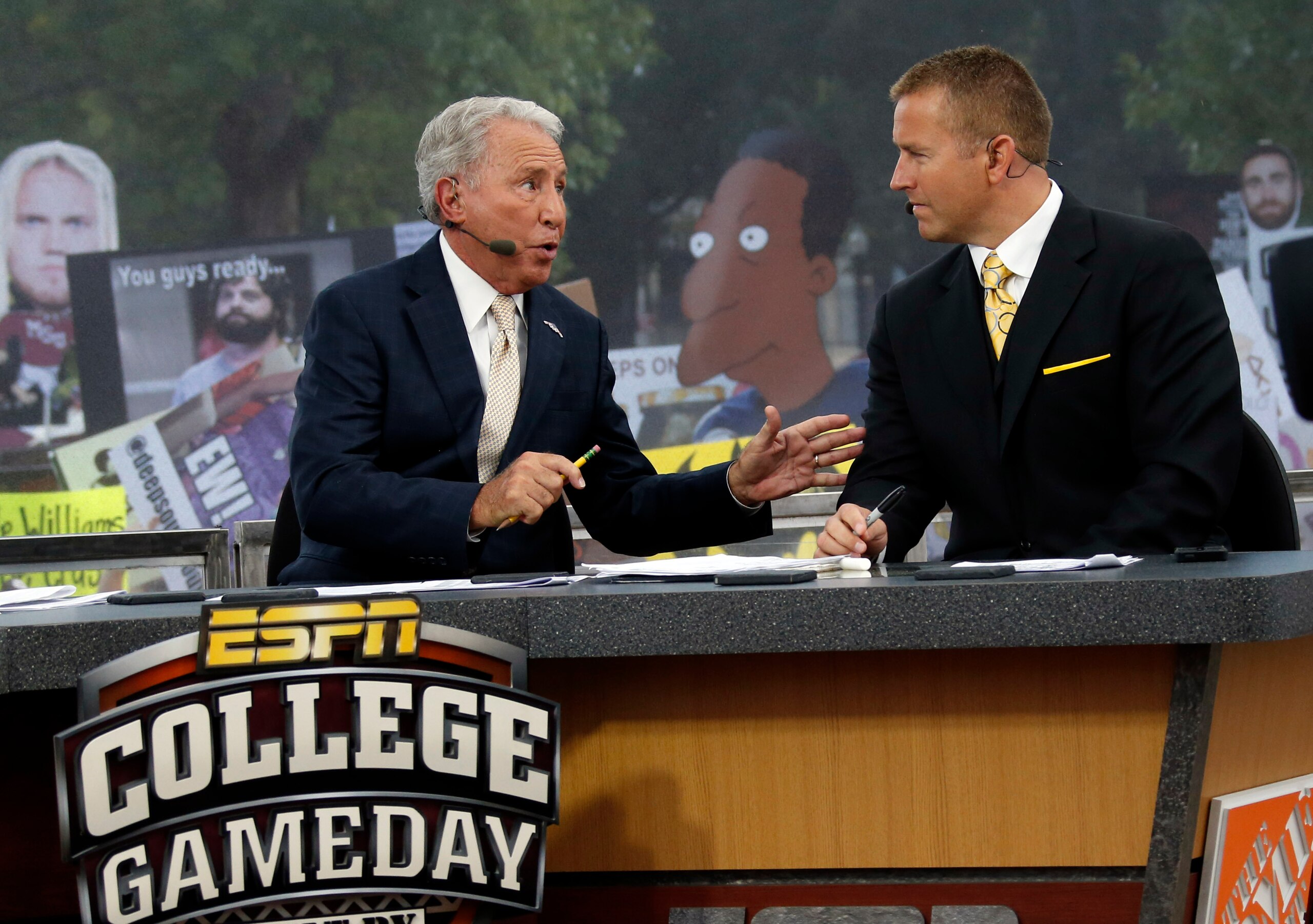 FILE - In this Oct. 11, 2014, file photo, ESPN College GameDay hosts Lee Corso, left, and Kirk Herbstreit confer during the telecast from The Junction prior to Mississippi State playing Auburn in an NCAA college football game in Starkville, Miss. This week the Cornhuskers are front and center. Their game against No. 5 Ohio State on Saturday night was always going to be a big one. Add a visit from ESPN’s “College GameDay” show in the morning, and it becomes huge. (AP Photo/Rogelio V. Solis, File)