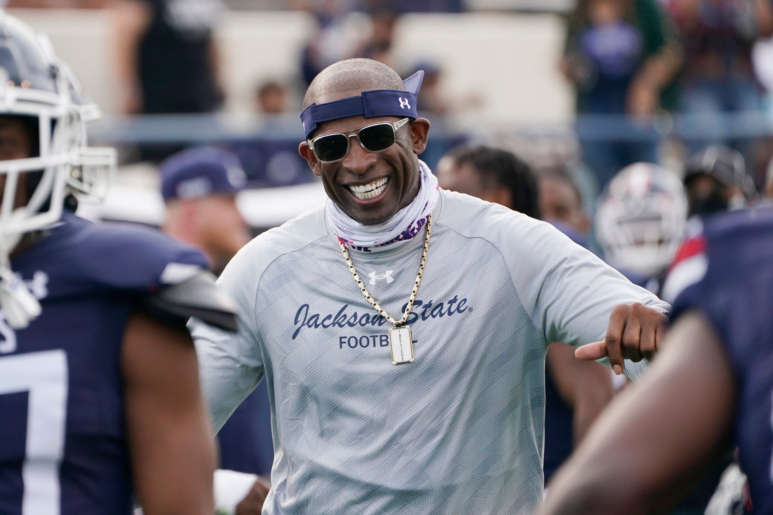 Jackson State football coach Deion Sanders smiles as he greets his defensive squad after they had recovered a Mississippi Valley State fumble for a touchdown during the second half of an NCAA college football game, Sunday, March 14, 2021, in Jackson, Miss. (AP Photo/Rogelio V. Solis) Jackson State football coach Deion Sanders smiles as he greets his defensive squad after they had recovered a Mississippi Valley State fumble for a touchdown during the second half of an NCAA college football game, Sunday, March 14, 2021, in Jackson, Miss. (AP Photo/Rogelio V. Solis)
