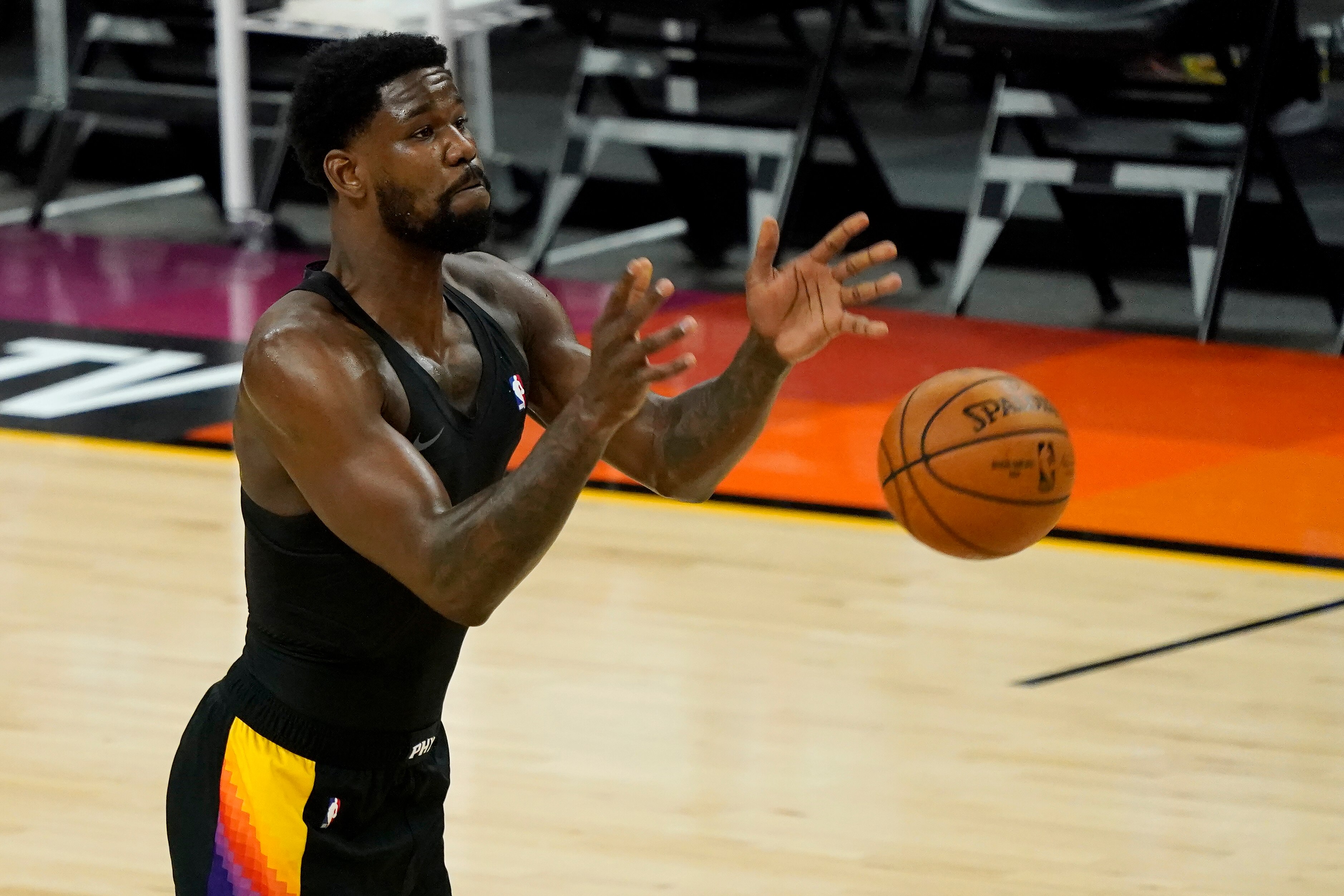 Phoenix Suns center Deandre Ayton warms up before Game 5 of basketball's NBA Finals against the Milwaukee Bucks, Saturday, July 17, 2021, in Phoenix. (AP Photo/Matt York)