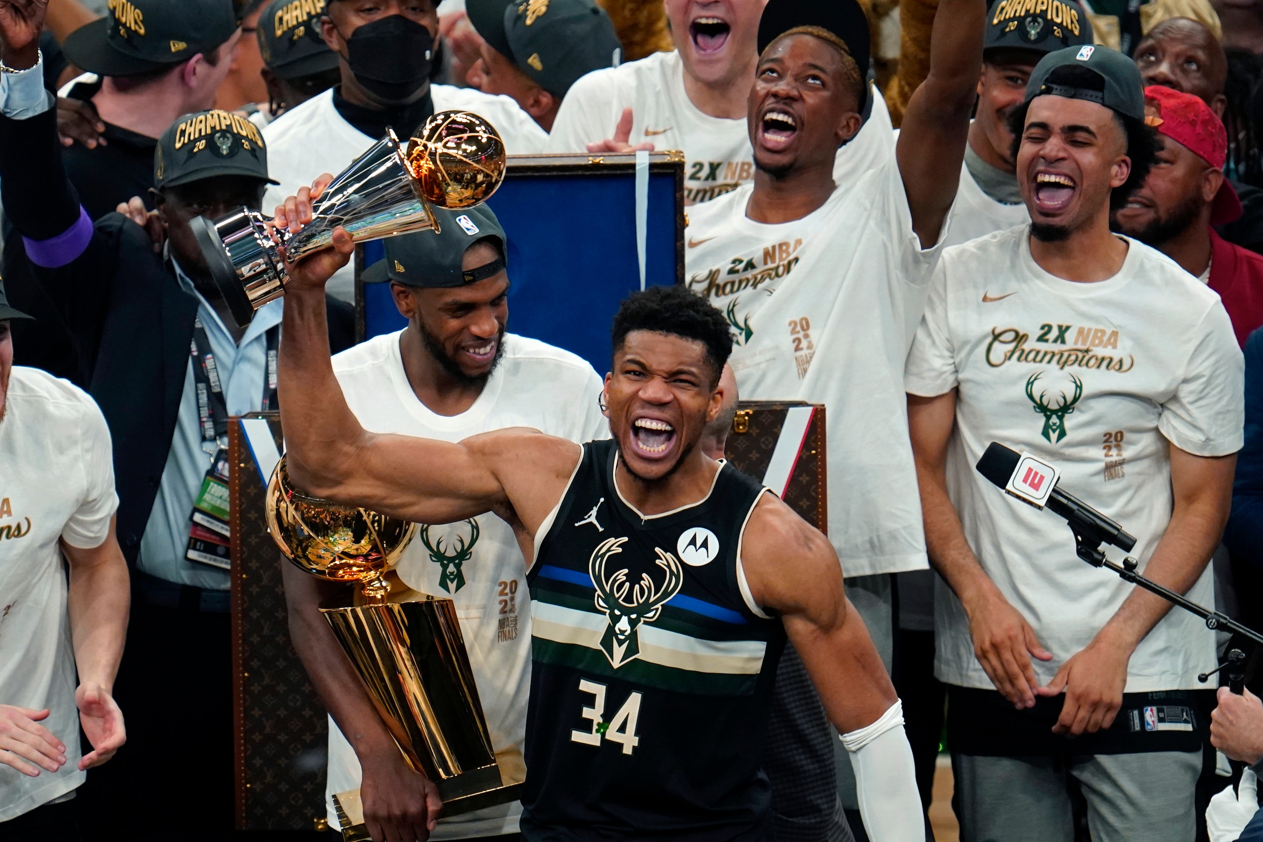 Milwaukee Bucks forward Giannis Antetokounmpo (34) holds the finals MVP trophy after the Bucks defeated the Phoenix Suns in Game 6 of basketball's NBA Finals in Milwaukee, Tuesday, July 20, 2021. The Bucks won 105-98. (AP Photo/Paul Sancya)