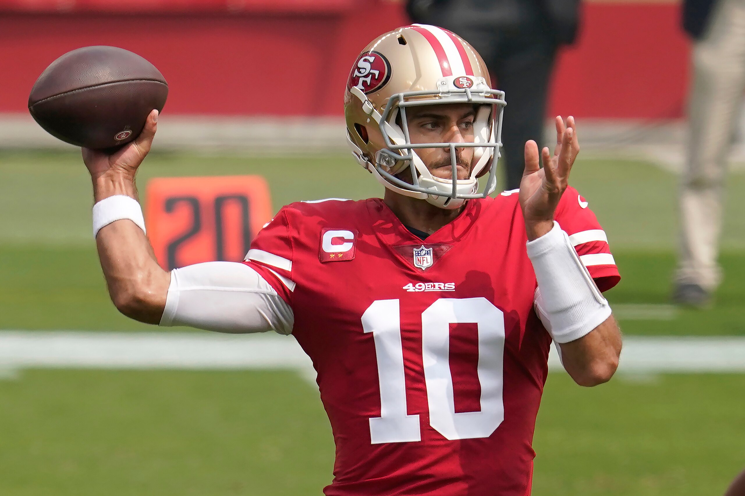 FILE - San Francisco 49ers quarterback Jimmy Garoppolo (10) passes against the Arizona Cardinals during the first half of an NFL football game in Santa Clara, Calif., in this Sunday, Sept. 13, 2020, file photo. The Matthew Stafford-Jared Goff trade not only has whet fans' appetites for big deals, it's caused a social media frenzy about which quarterbacks are headed elsewhere. (AP Photo/Tony Avelar, File)