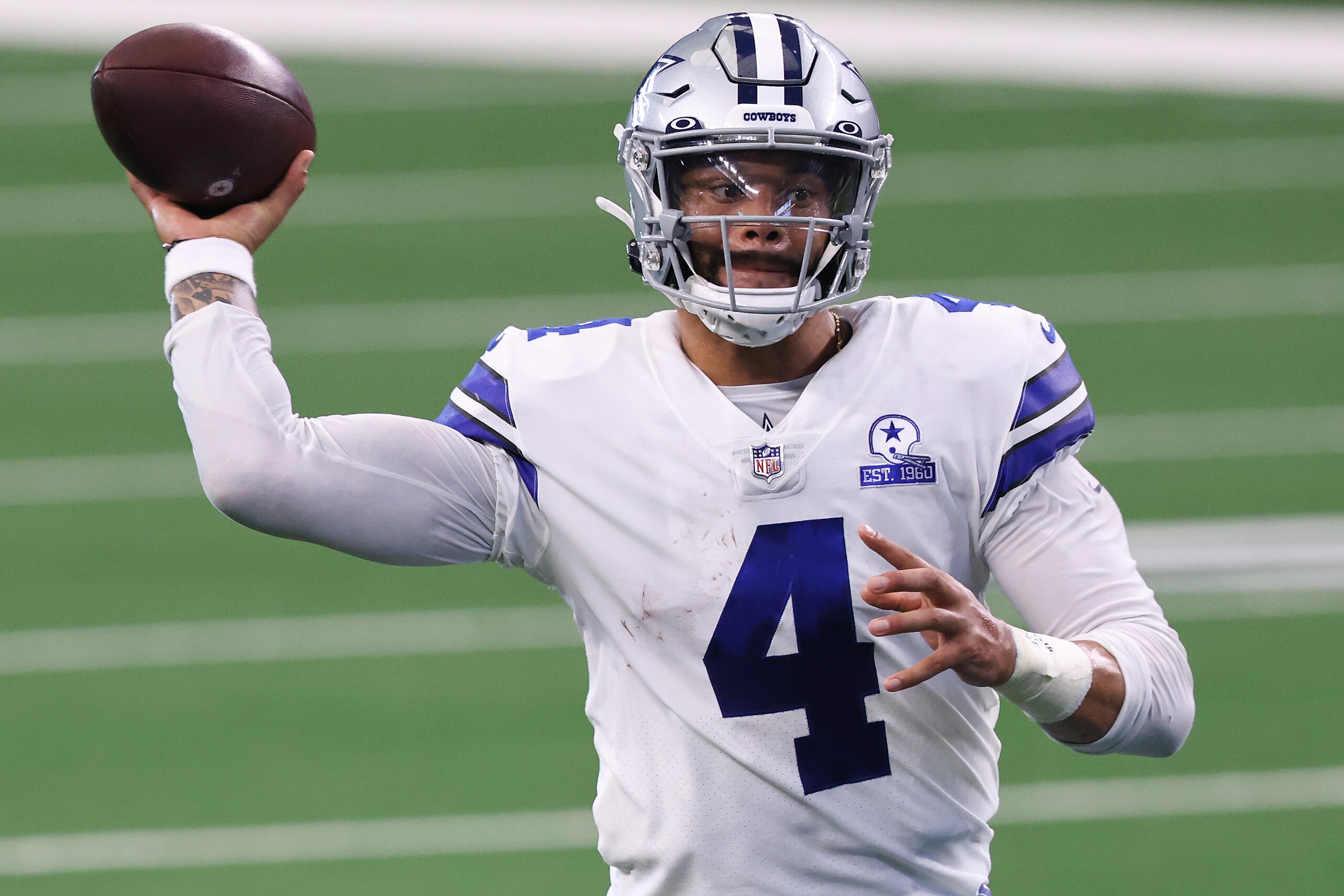 ARLINGTON, TEXAS - OCTOBER 11:  Dak Prescott #4 of the Dallas Cowboys attempts a pass against the New York Giants during the second quarter at AT&T Stadium on October 11, 2020 in Arlington, Texas. (Photo by Tom Pennington/Getty Images)