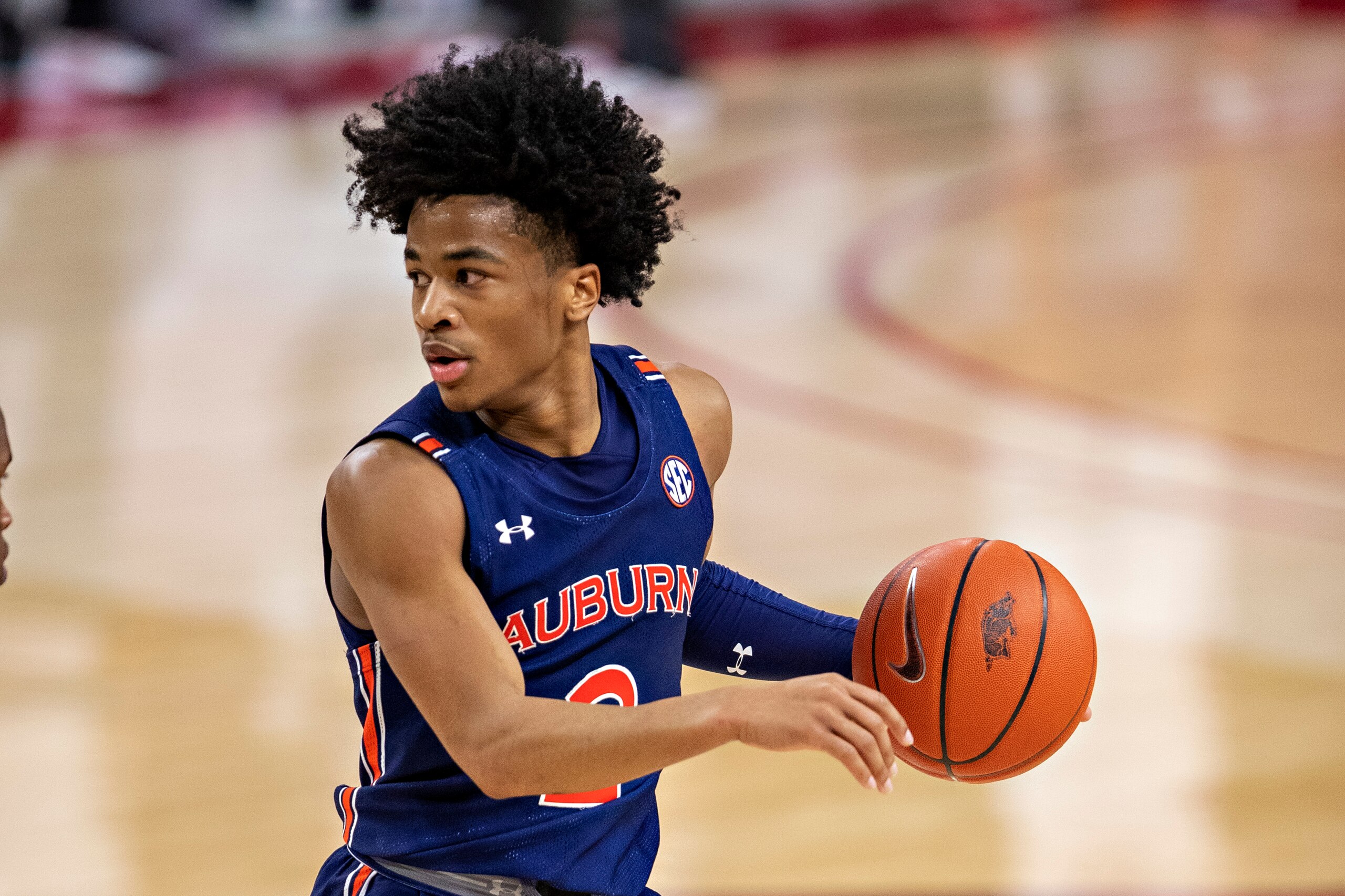 FAYETTEVILLE, ARKANSAS - JANUARY 20: Sharife Cooper #2 of the Auburn Tigers directs the offense in the second half of a game against the Arkansas Razorbacks at Bud Walton Arena on January 20, 2021 in Fayetteville, Arkansas. The Razorbacks defeated the Tigers 75-73.  (Photo by Wesley Hitt/Getty Images)
