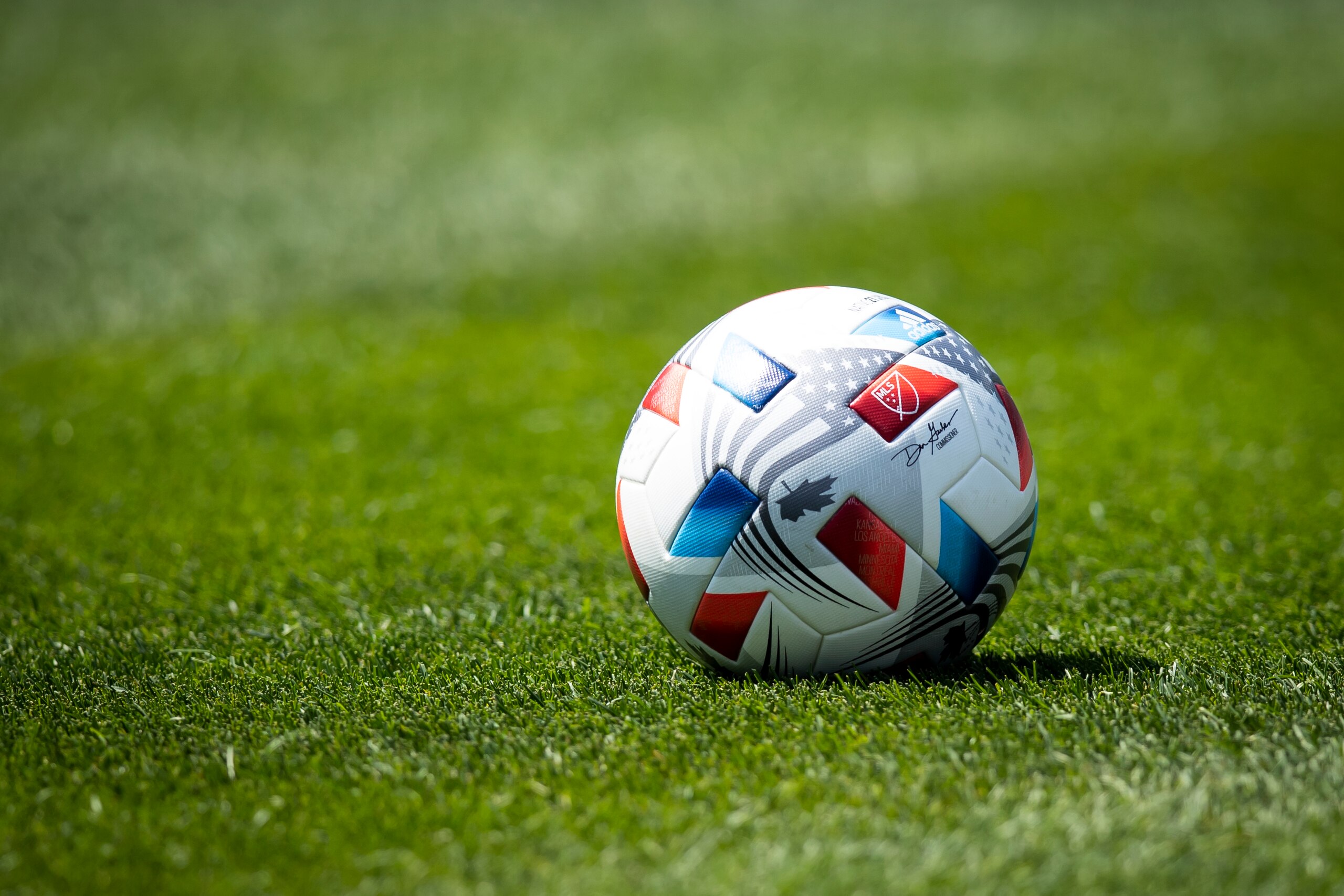 NEW YORK, NY - APRIL 24: One of the Adidas game balls with the logo to MLS and signature by Don Garber Commissioner of Major League Soccer on the pitch for the home opener match against between New York City FC and FC Cincinnati at Yankee Stadium on April 24, 2021 in New York City. (Photo by Ira L. Black - Corbis/Getty Images)
