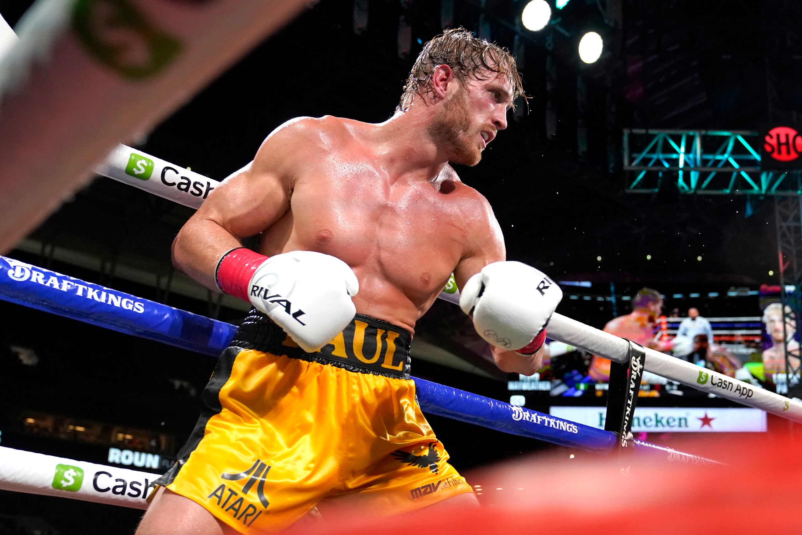 Logan Paul fights Floyd Mayweather during an exhibition boxing match at Hard Rock Stadium, Sunday, June 6, 2021, in Miami Gardens, Fla. (AP Photo/Lynne Sladky)