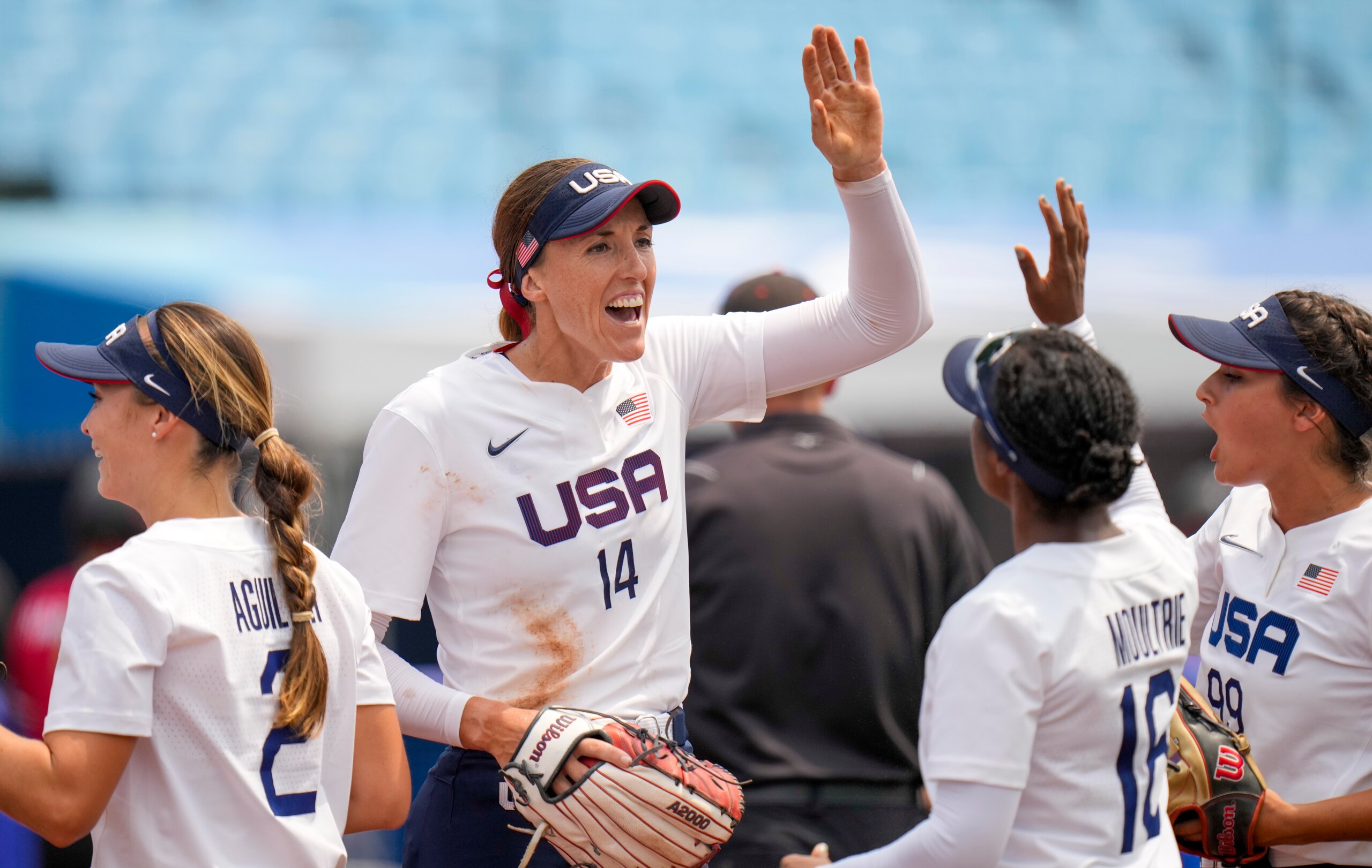 United States' Monica Abbott celebrates with teammates during the softball game between the United States and Canada at the 2020 Summer Olympics, Thursday, July 22, 2021, in Fukushima , Japan. (AP Photo/Jae C. Hong)