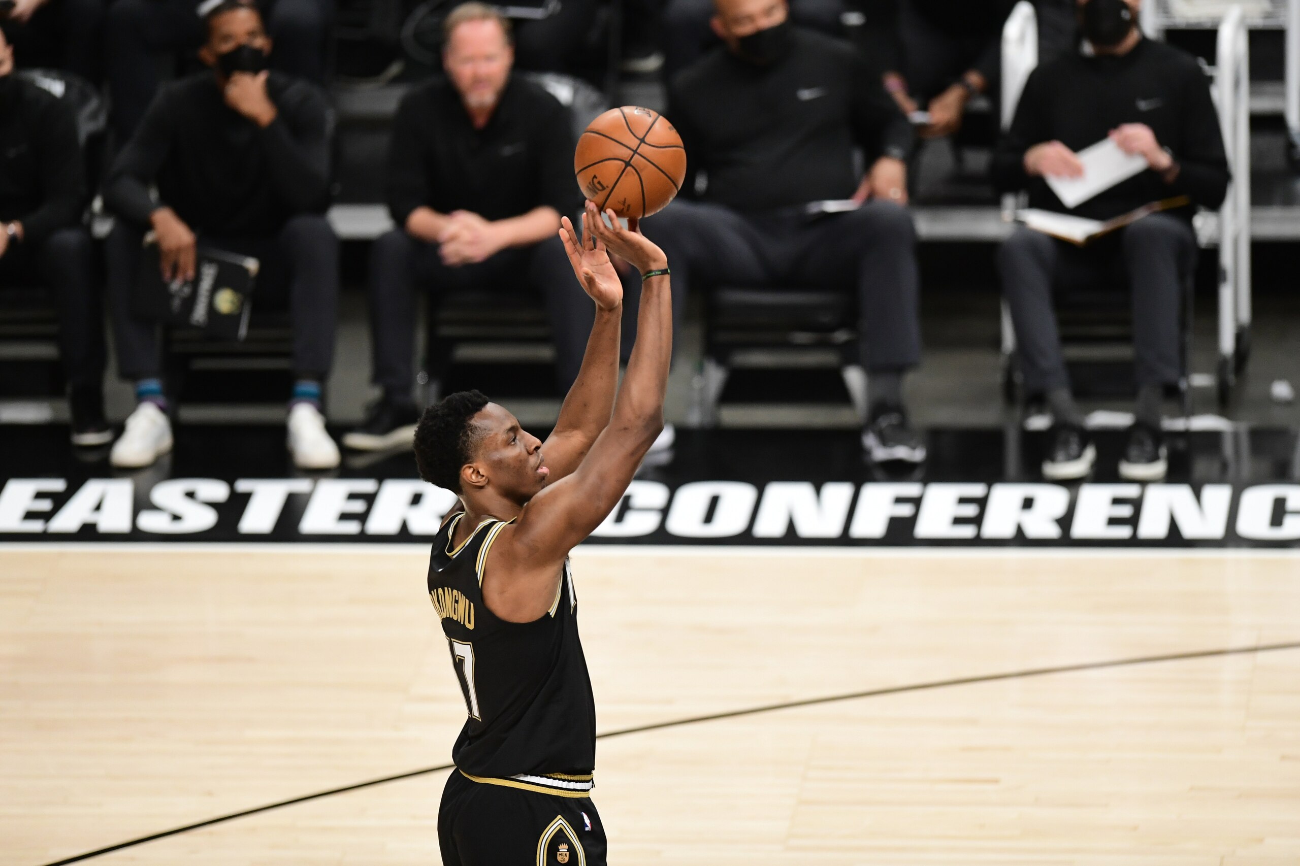 ATLANTA, GA - JuNE 29: Onyeka Okongwu #17 of the Atlanta Hawks shoots a free throw against the Milwaukee Bucks during Game 4 of the Eastern Conference Finals of the 2021 NBA Playoffs on June 29, 2021 at State Farm Arena in Atlanta, Georgia.  NOTE TO USER: User expressly acknowledges and agrees that, by downloading and/or using this Photograph, user is consenting to the terms and conditions of the Getty Images License Agreement. Mandatory Copyright Notice: Copyright 2021 NBAE (Photo by Adam Hagy/NBAE via Getty Images)