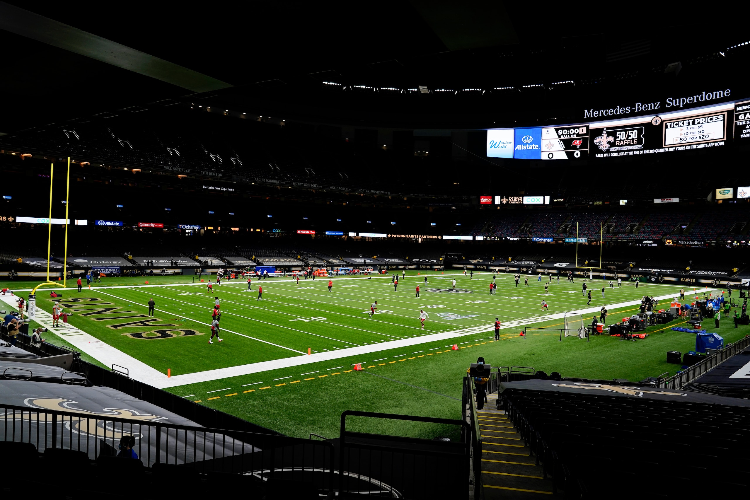 Teams warm up before the first half of an NFL divisional round playoff football game between the New Orleans Saints and the Tampa Bay at the Buccaneers Mercedes-Benz Superdome, Sunday, Jan. 17, 2021, in New Orleans. (AP Photo/Brynn Anderson)