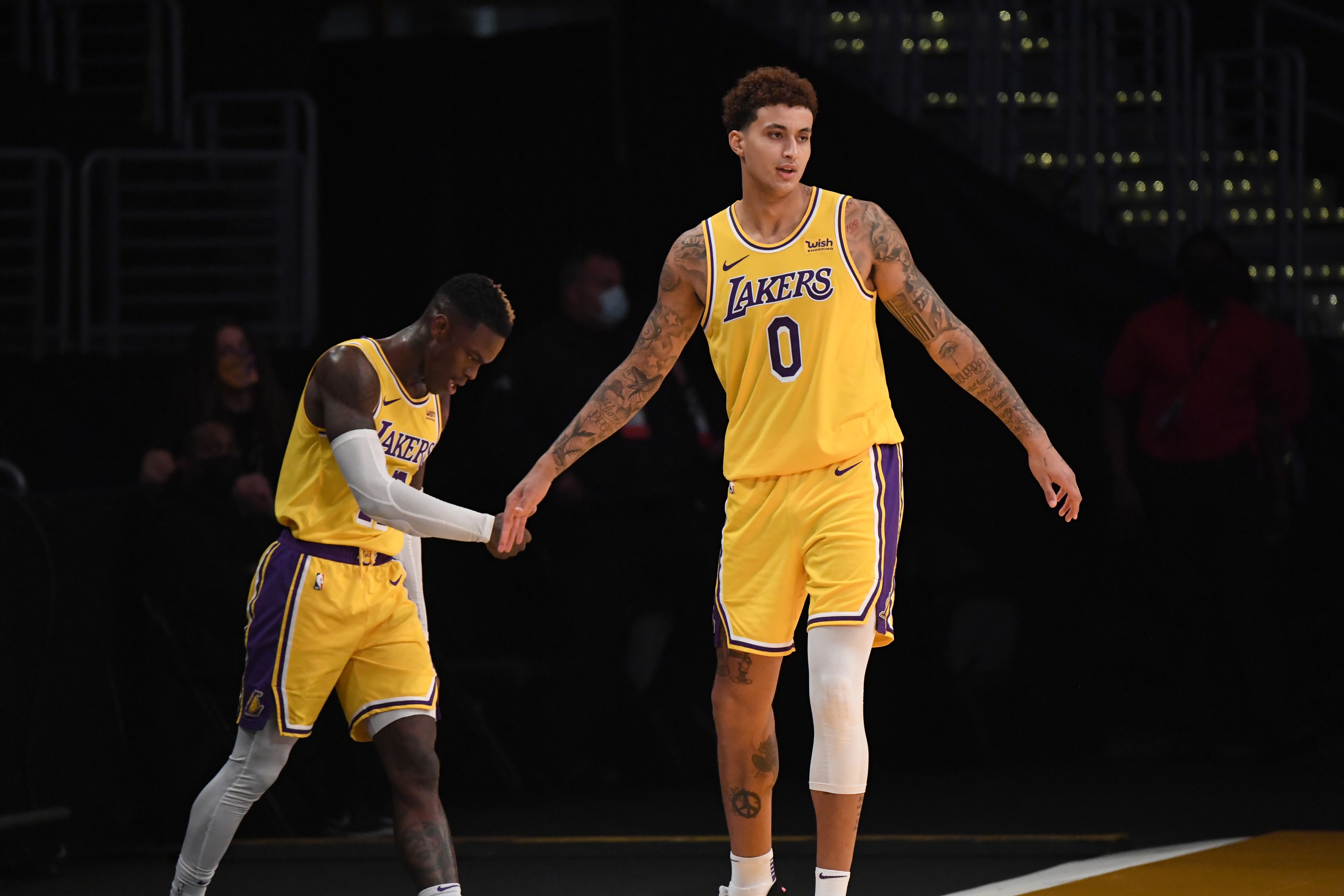 LOS ANGELES, CA - JANUARY 18: Dennis Schroder #17 and Kyle Kuzma #0 of the Los Angeles Lakers hi-five during the game against the Golden State Warriors on January 18, 2021 at STAPLES Center in Los Angeles, California. NOTE TO USER: User expressly acknowledges and agrees that, by downloading and/or using this Photograph, user is consenting to the terms and conditions of the Getty Images License Agreement. Mandatory Copyright Notice: Copyright 2021 NBAE (Photo by Adam Pantozzi/NBAE via Getty Images)