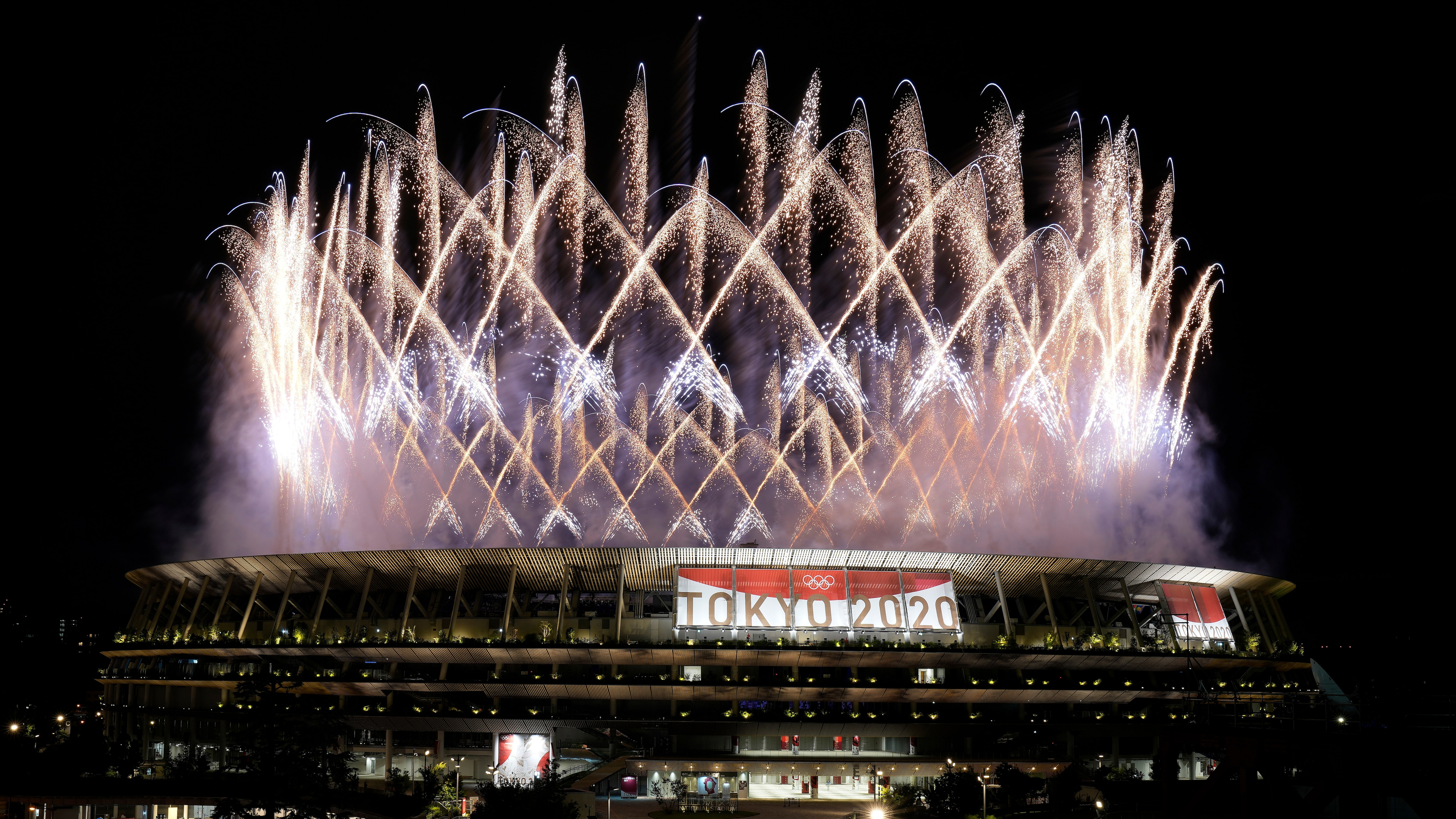 Fireworks illuminate over the National Stadium during the opening ceremony of the 2020 Summer Olympics, Friday, July 23, 2021, in Tokyo. (AP Photo/Shuji Kajiyama)