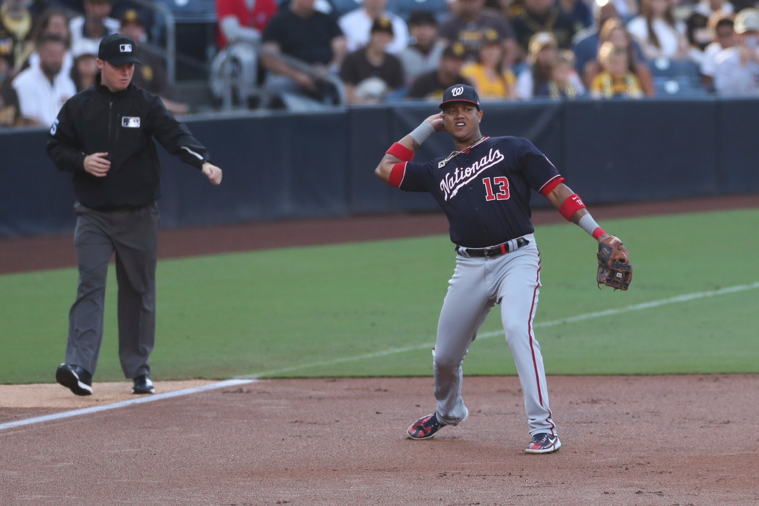 Washington Nationals third baseman Starlin Castro throws to first for the out in the first inning of a baseball game against the San Diego Padres Thursday, July 8, 2021, in San Diego. (AP Photo/Derrick Tuskan)