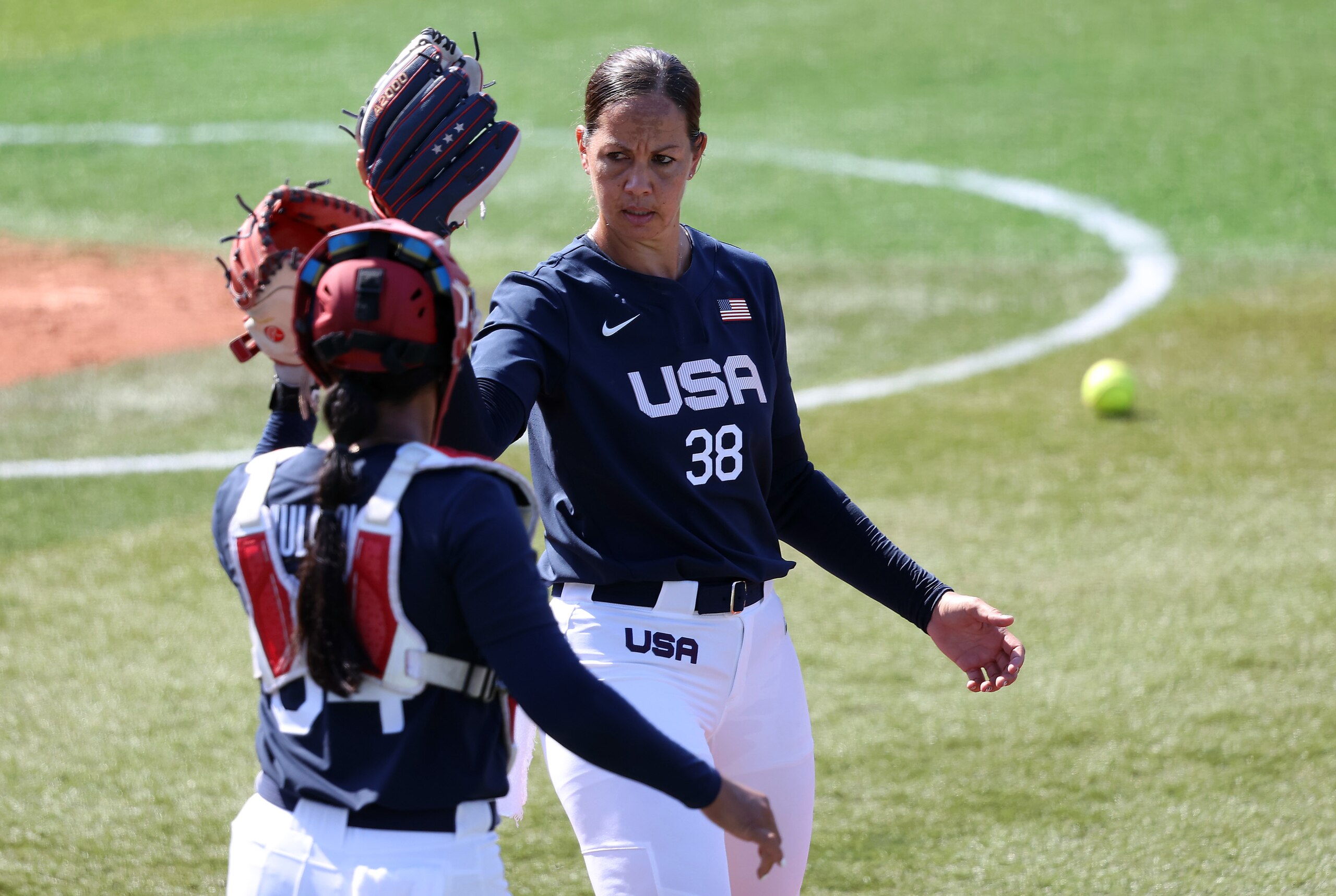 YOKOHAMA, JAPAN - JULY 24: Pitcher Catherine Osterman #38 of Team United States high fives with catcher Dejah Mulipola #34 in the first inning of the game against Team Mexico during the Softball Opening Round on day one of the Tokyo 2020 Olympic Games at Yokohama Baseball Stadium on July 24, 2021 in Yokohama, Kanagawa, Japan. (Photo by Yuichi Masuda/Getty Images) YOKOHAMA, JAPAN - JULY 24: Pitcher Catherine Osterman #38 of Team United States high fives with catcher Dejah Mulipola #34 in the first inning of the game against Team Mexico during the Softball Opening Round on day one of the Tokyo 2020 Olympic Games at Yokohama Baseball Stadium on July 24, 2021 in Yokohama, Kanagawa, Japan. (Photo by Yuichi Masuda/Getty Images)