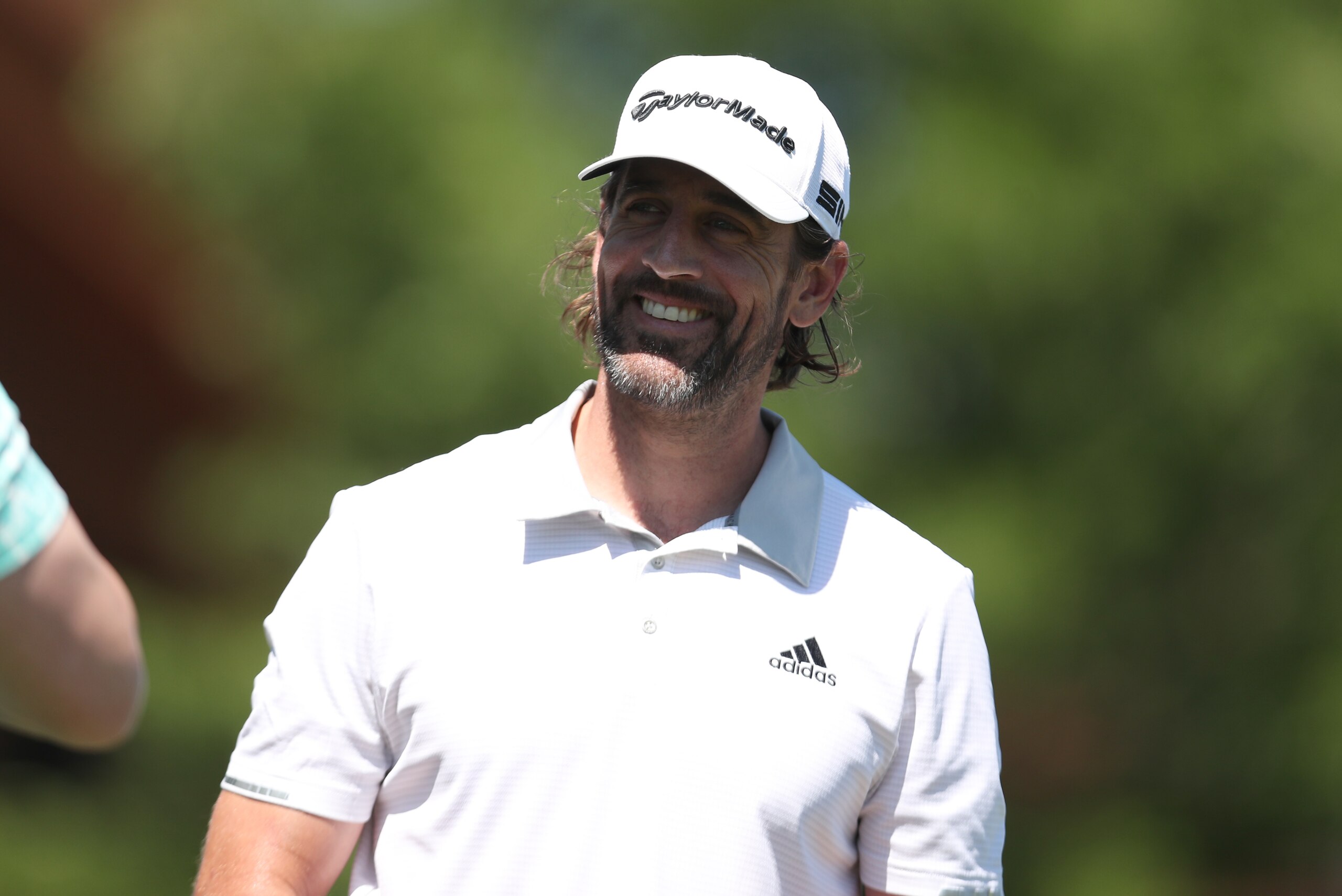 SOUTH LAKE TAHOE, NEVADA - JULY 9: NFL athlete Aaron Rodgers smiles on the first hole during round one of the American Century Championship at Edgewood Tahoe South golf course on July 9, 2020 in South Lake Tahoe, Nevada.  (Photo by Jed Jacobsohn/Getty Images)