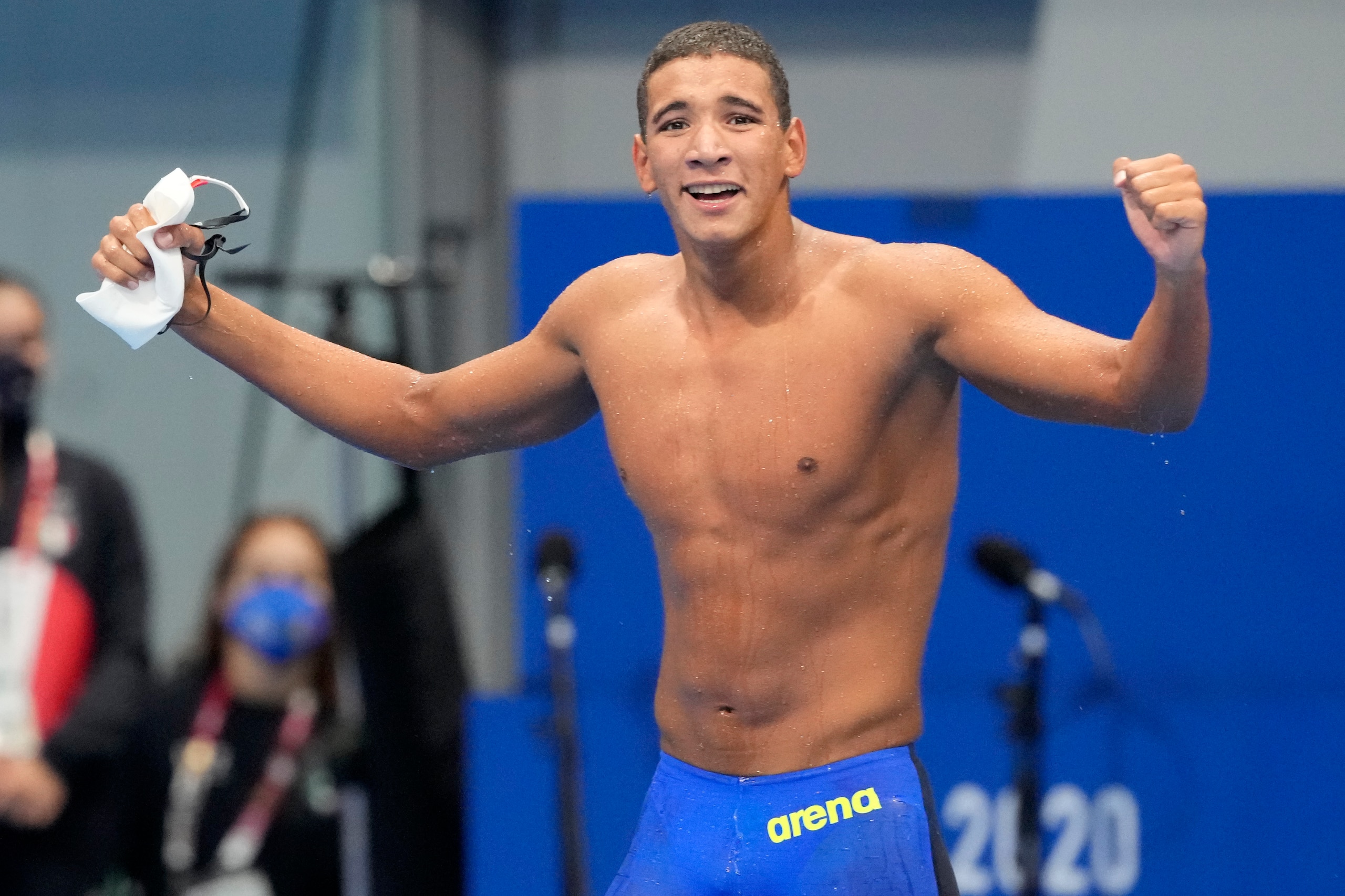 Ahmed Hafnaoui, of Tunisia, celebrates after winning the final of the men's 400-meter freestyle at the 2020 Summer Olympics, Sunday, July 25, 2021, in Tokyo, Japan. (AP Photo/Martin Meissner)