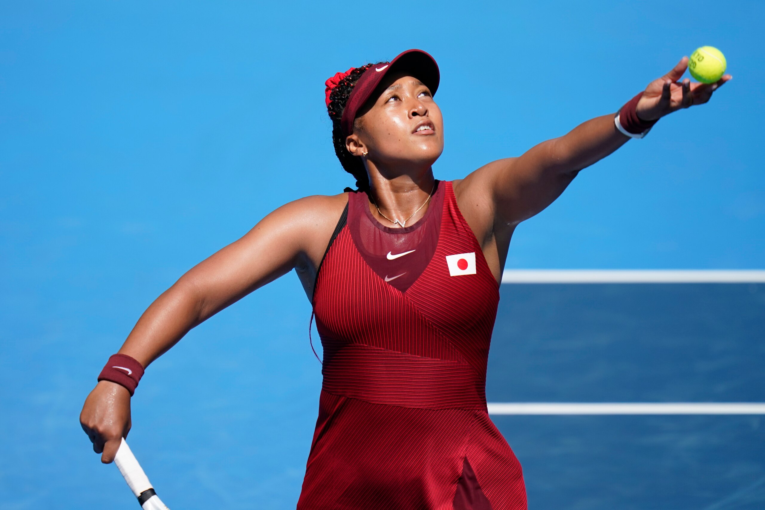 Naomi Osaka, of Japan, plays against Saisai Zheng, of China, during the first round of the tennis competition at the 2020 Summer Olympics, Sunday, July 25, 2021, in Tokyo, Japan. (AP Photo/Seth Wenig)