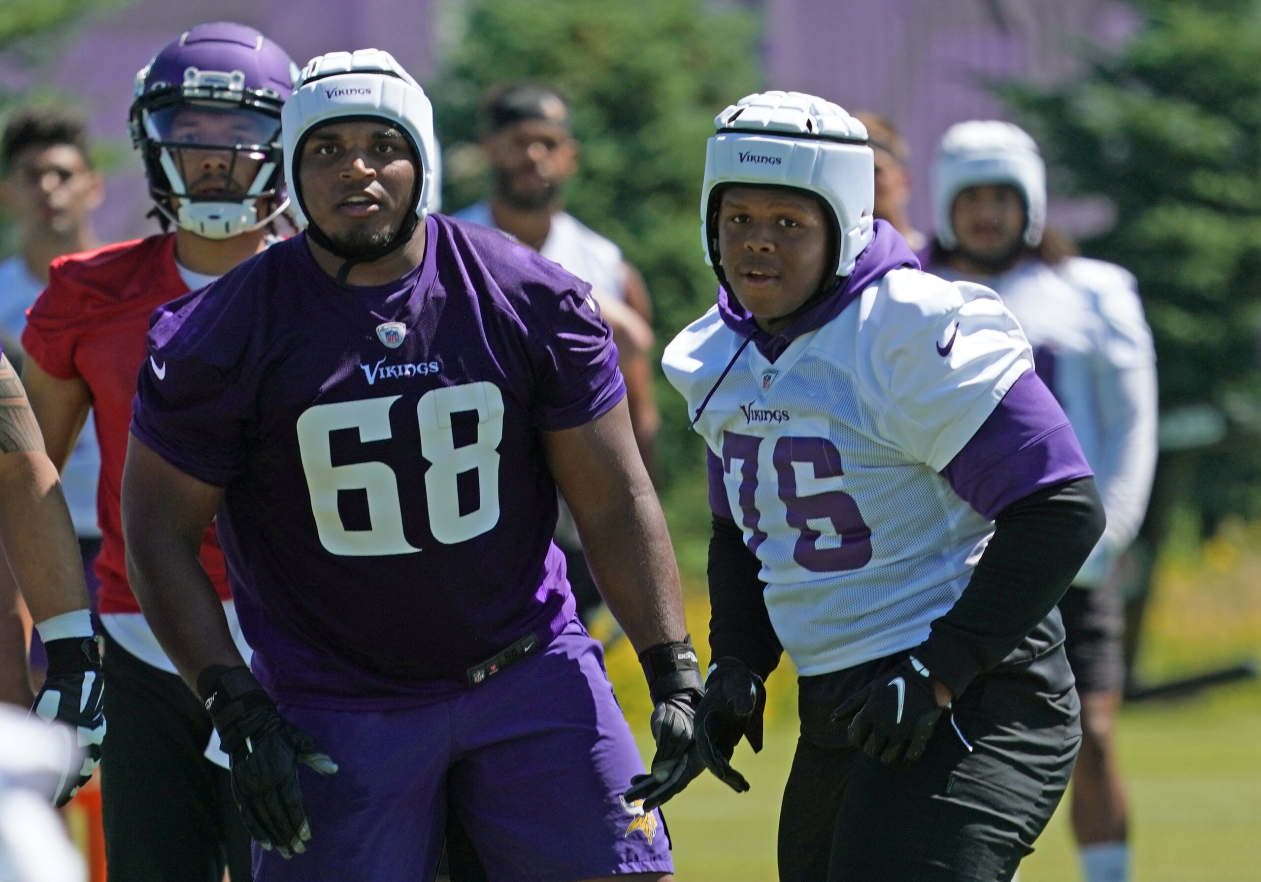 EAGAN, MN - JUNE 16: Minnesota Vikings guard Kyle Hinton (68) and Minnesota Vikings defensive tackle Jaylen Twyman (76) follow the play during Vikings Minicamp on June 16, 2021 at Twin Cities Orthopedics Performance Center in Eagan, Minnesota. (Photo by Nick Wosika/Icon Sportswire via Getty Images)