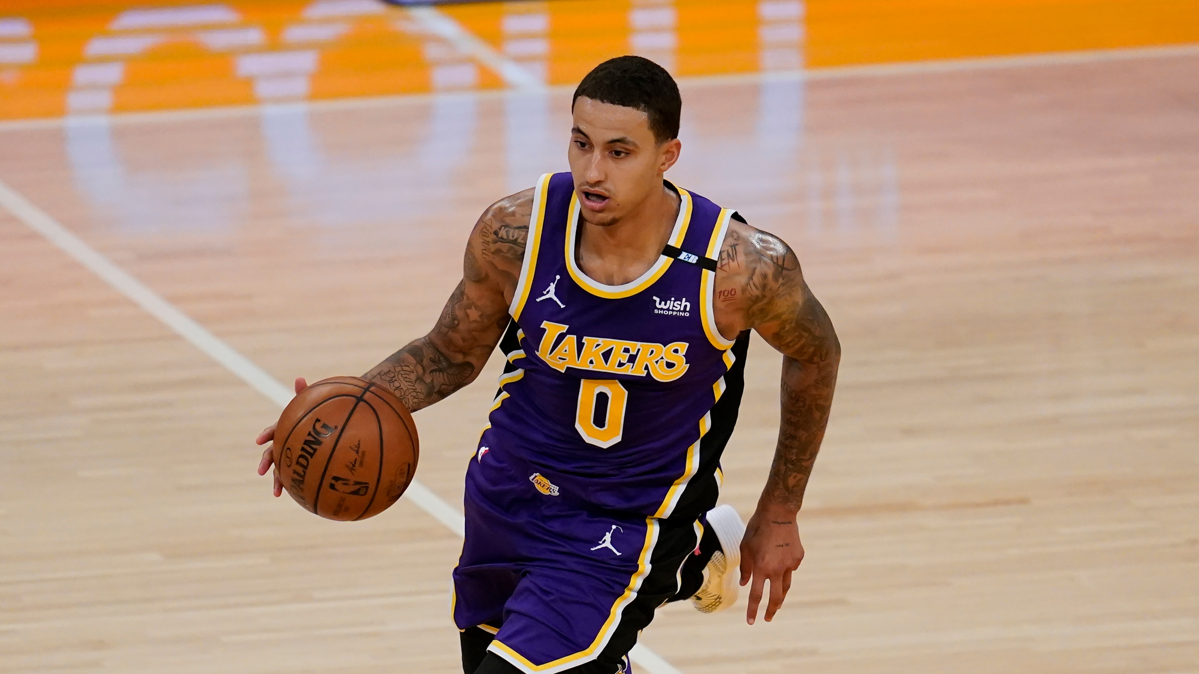 Los Angeles Lakers forward Kyle Kuzma (0) controls the ball during an NBA basketball game against the New York Knicks Tuesday, May 11, 2021, in Los Angeles. (AP Photo/Ashley Landis)