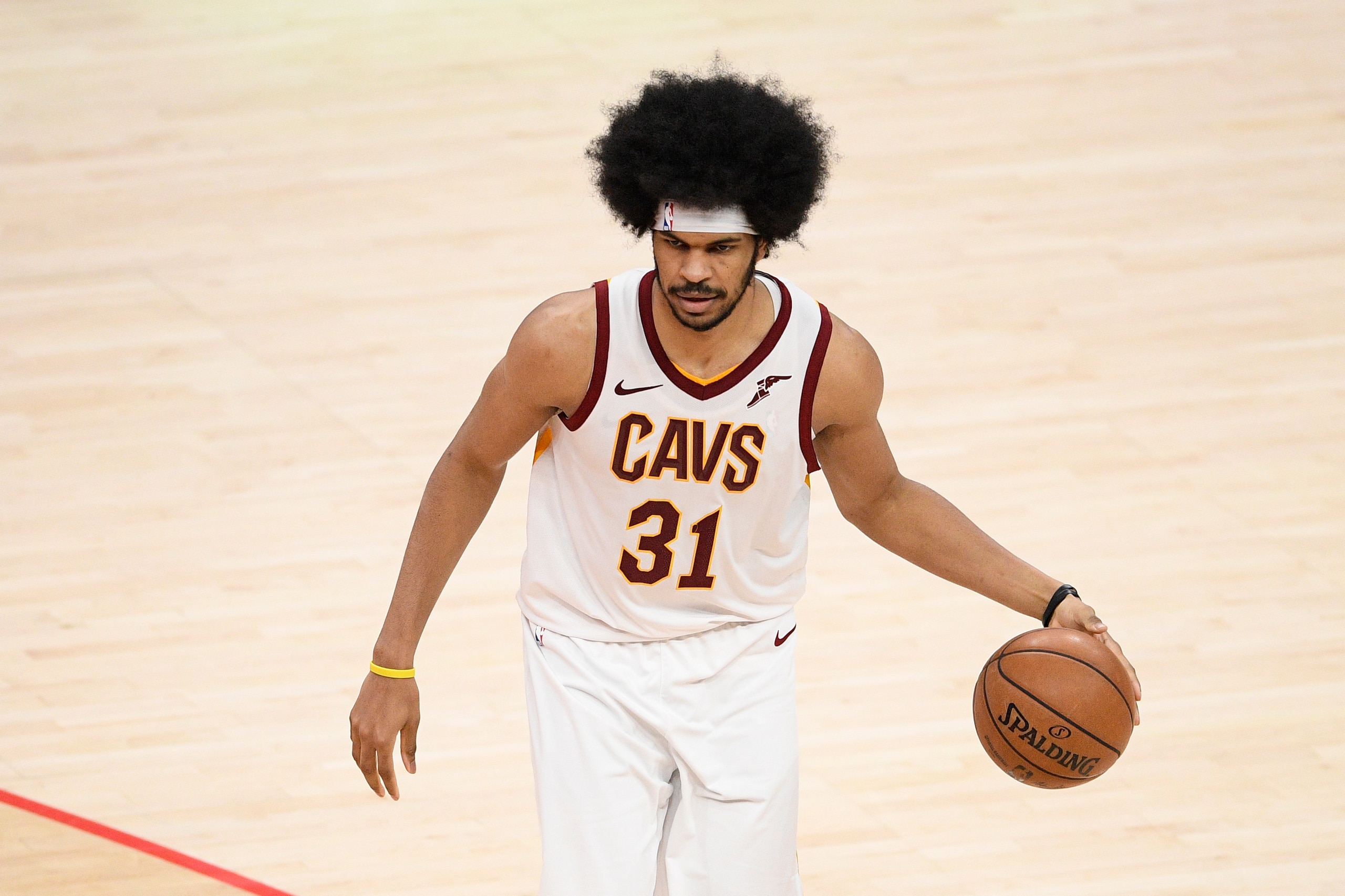 Cleveland Cavaliers center Jarrett Allen (31) dribbles the ball during the second half of an NBA basketball game against the Washington Wizards, Friday, May 14, 2021, in Washington. (AP Photo/Nick Wass)