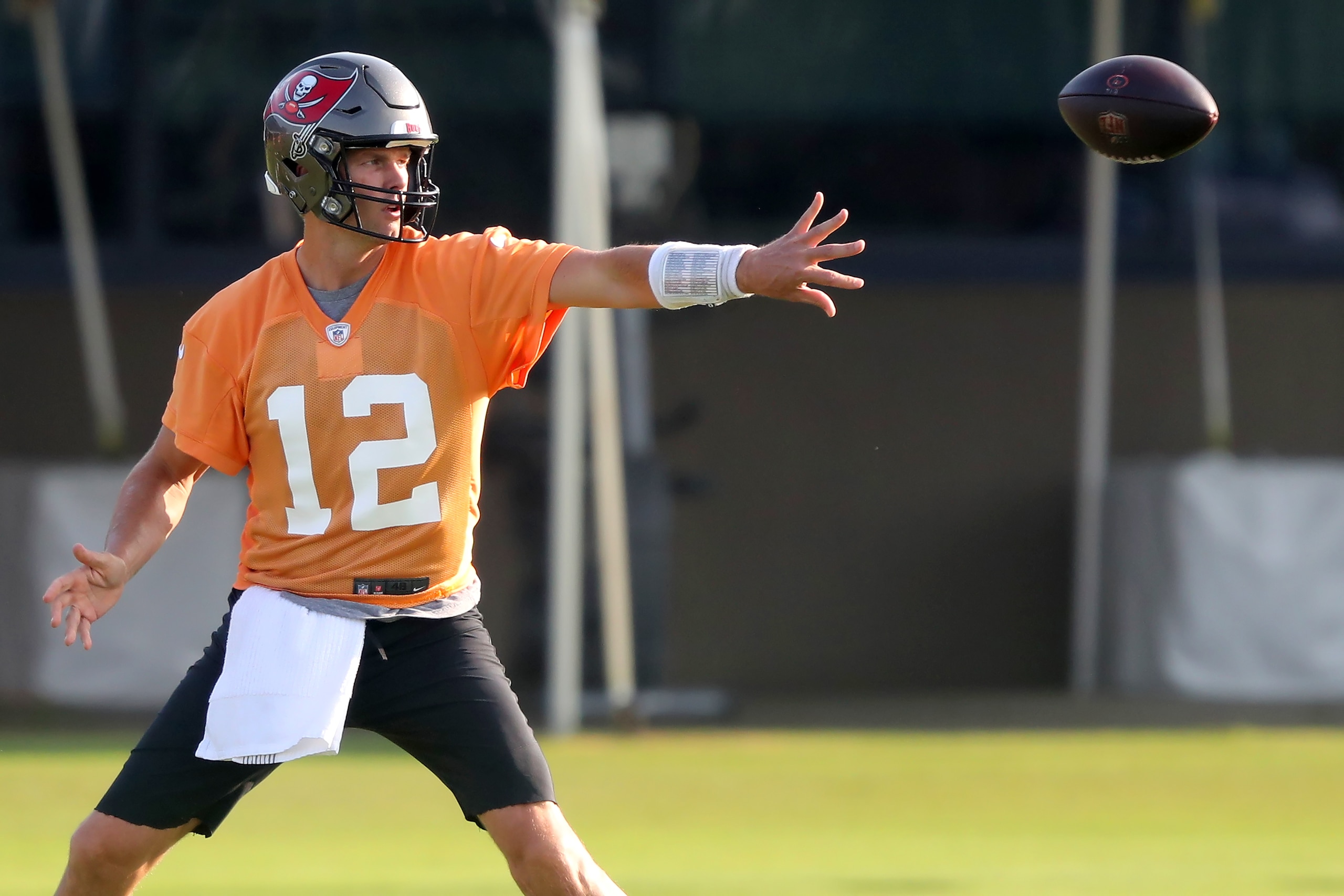 TAMPA, FL - JUL 25: Tom Brady (12) options the ball to the running back during the Tampa Bay Buccaneers Training Camp on July 25, 2021 at the AdventHealth Training Center at One Buccaneer Place in Tampa, Florida. (Photo by Cliff Welch/Icon Sportswire via Getty Images)