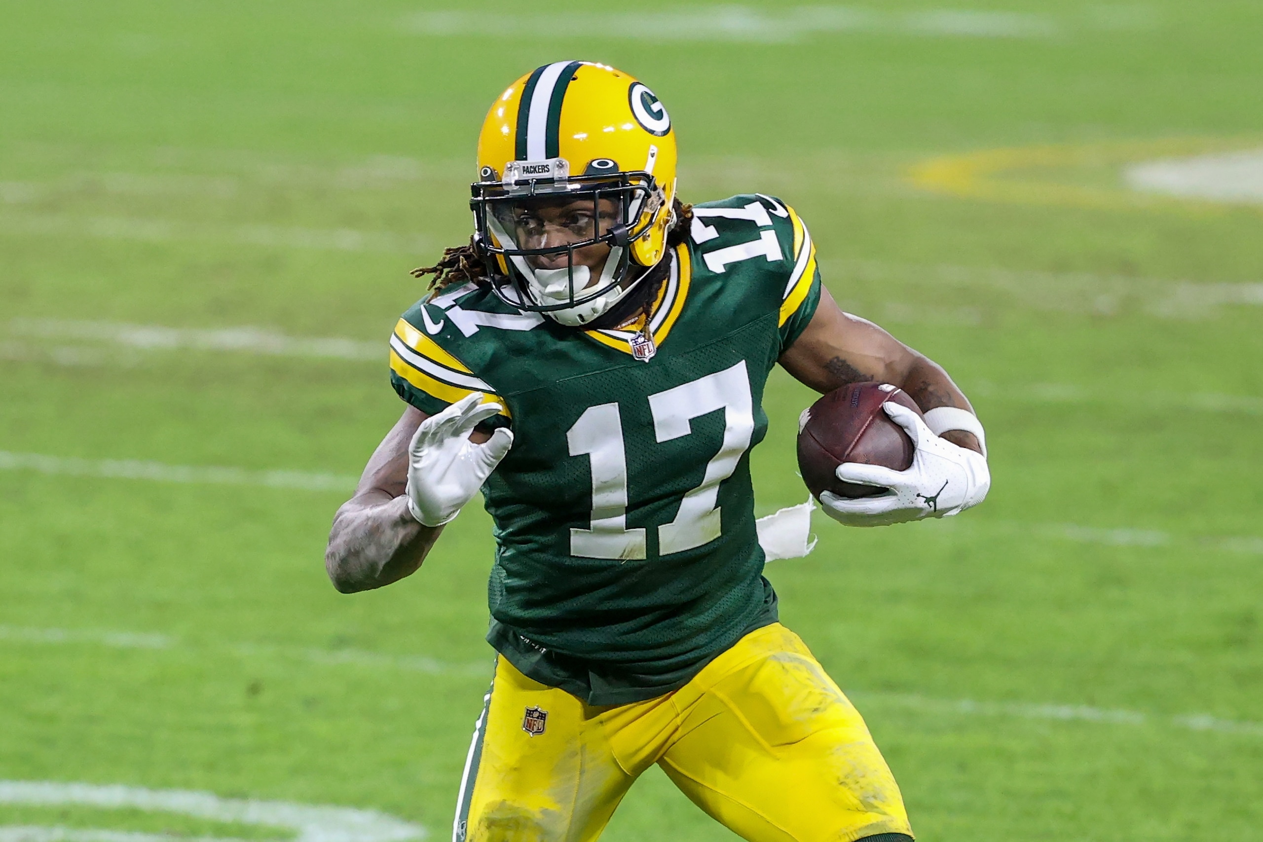 GREEN BAY, WISCONSIN - JANUARY 24: Davante Adams #17 of the Green Bay Packers runs with the ball in the fourth quarter against the Tampa Bay Buccaneers during the NFC Championship game at Lambeau Field on January 24, 2021 in Green Bay, Wisconsin. (Photo by Dylan Buell/Getty Images)