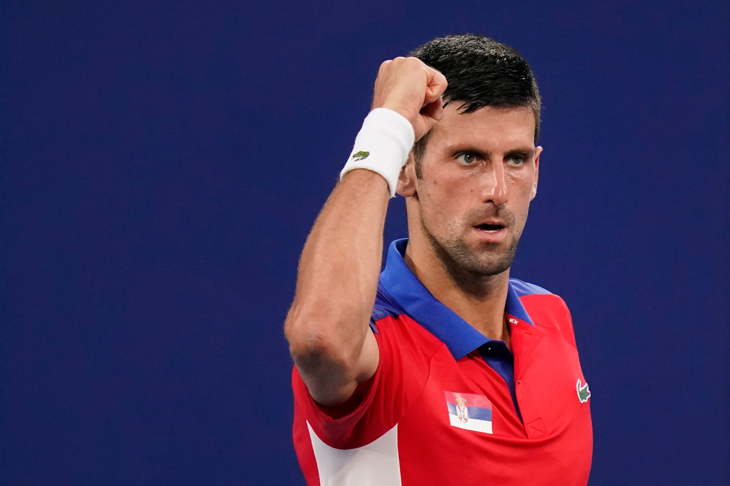 Novak Djokovic, of Serbia, reacts during a second round tennis match against Jan-Lennard Struff, of Germany, at the 2020 Summer Olympics, Monday, July 26, 2021, in Tokyo, Japan. (AP Photo/Patrick Semansky)