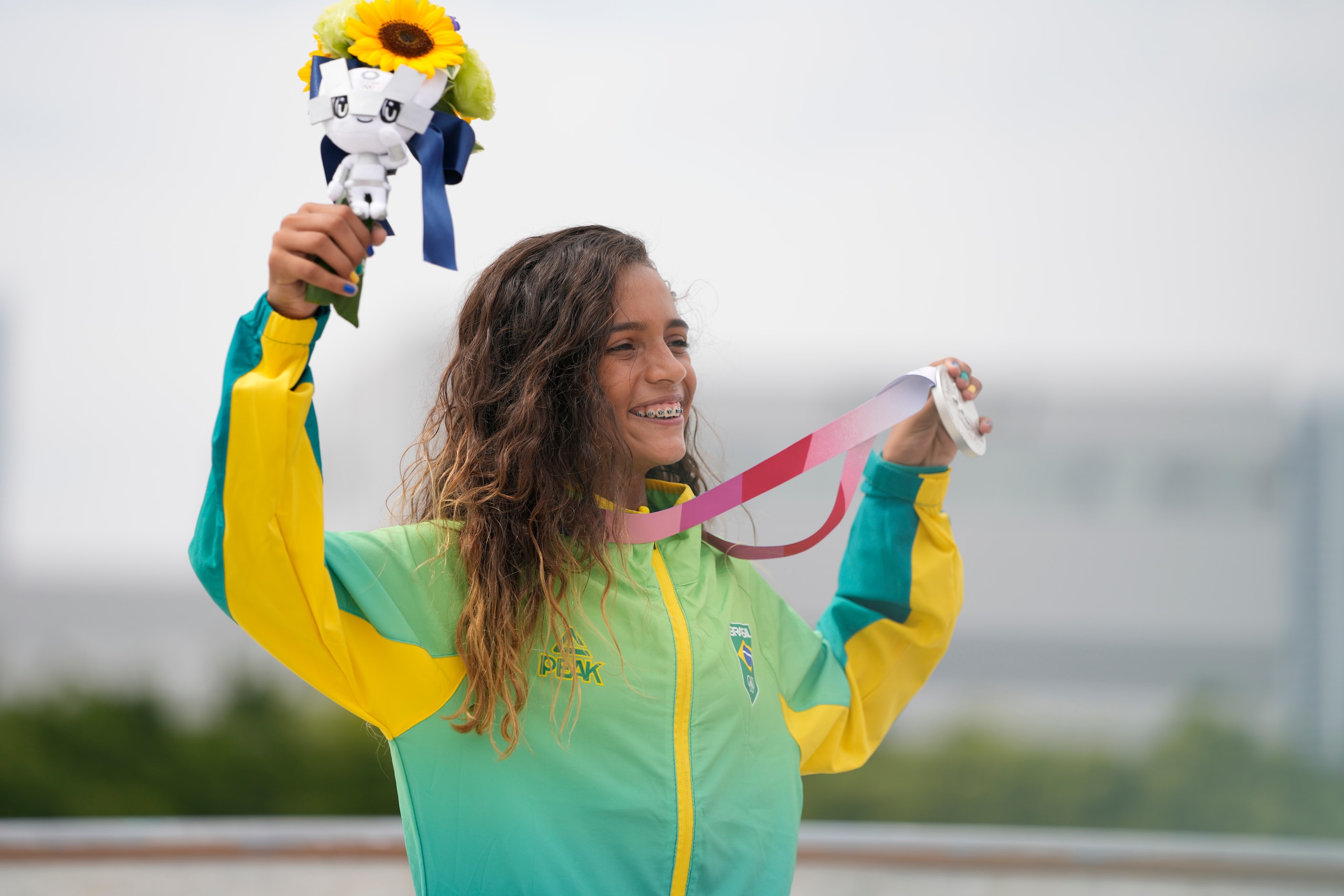 Silver medal winner Rayssa Leal of Brazil holds her medal after winning the women's street skateboarding finals at the 2020 Summer Olympics, Monday, July 26, 2021, in Tokyo, Japan. (AP Photo/Ben Curtis)