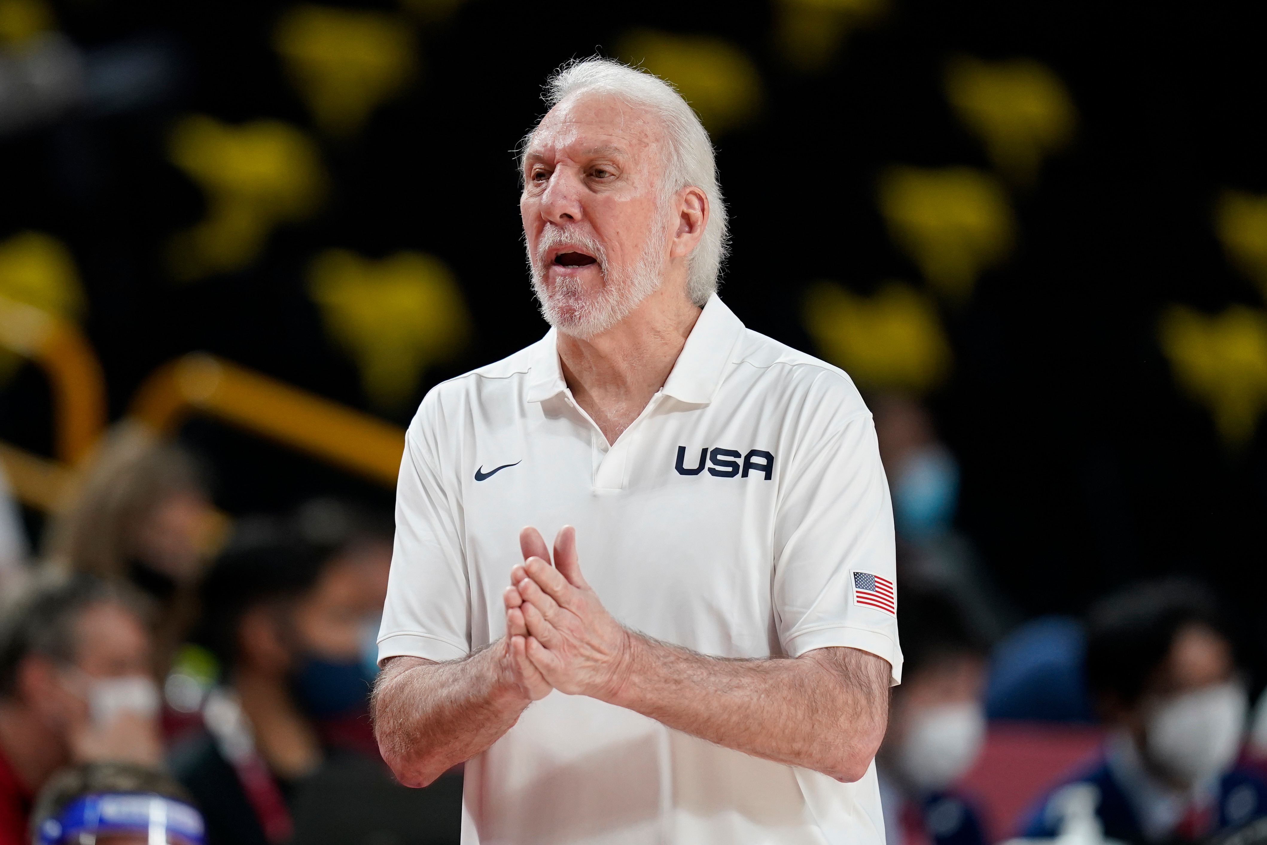United States head coach Gregg Popovich questions a call against his team during a men's basketball preliminary round game against France at the 2020 Summer Olympics, Sunday, July 25, 2021, in Saitama, Japan. (AP Photo/Charlie Neibergall)