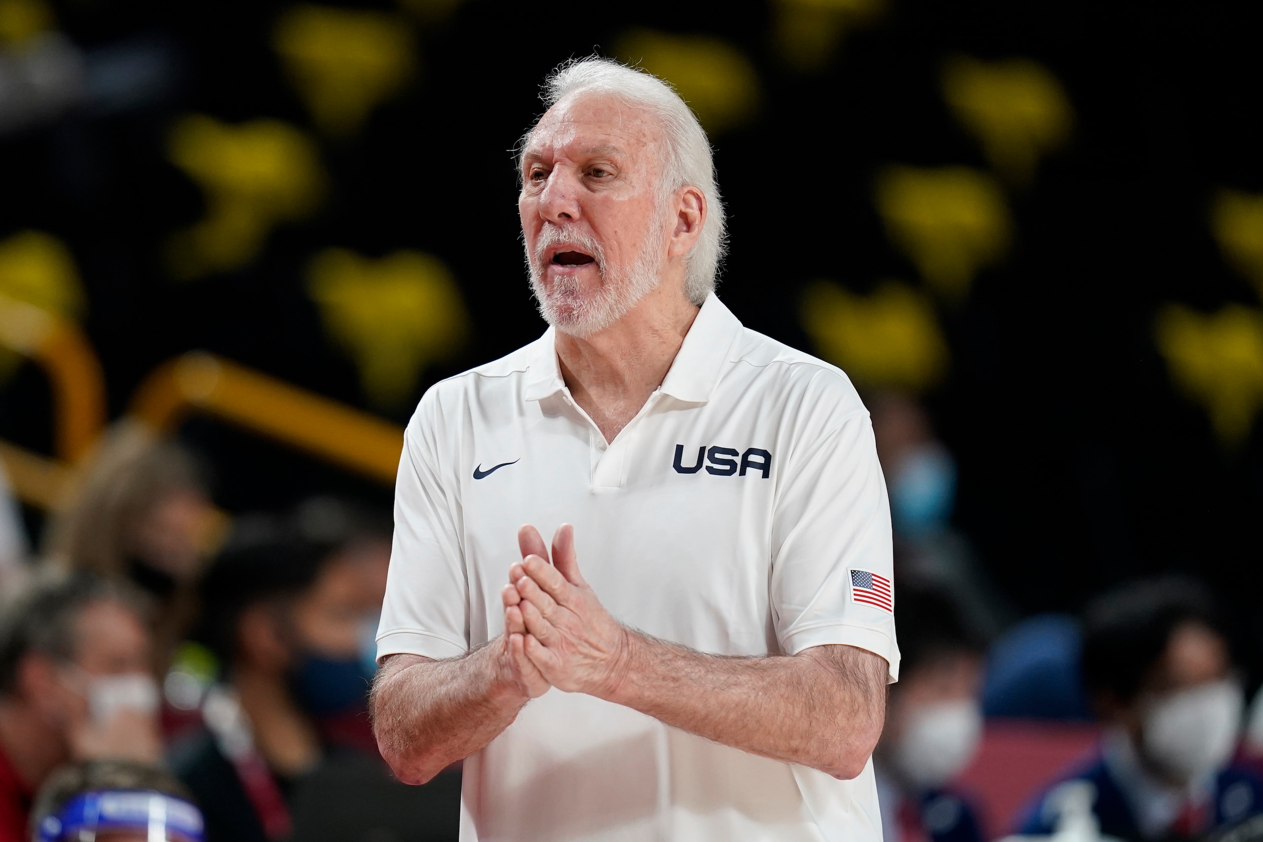 United States head coach Gregg Popovich questions a call against his team during a men's basketball preliminary round game against France at the 2020 Summer Olympics, Sunday, July 25, 2021, in Saitama, Japan. (AP Photo/Charlie Neibergall)