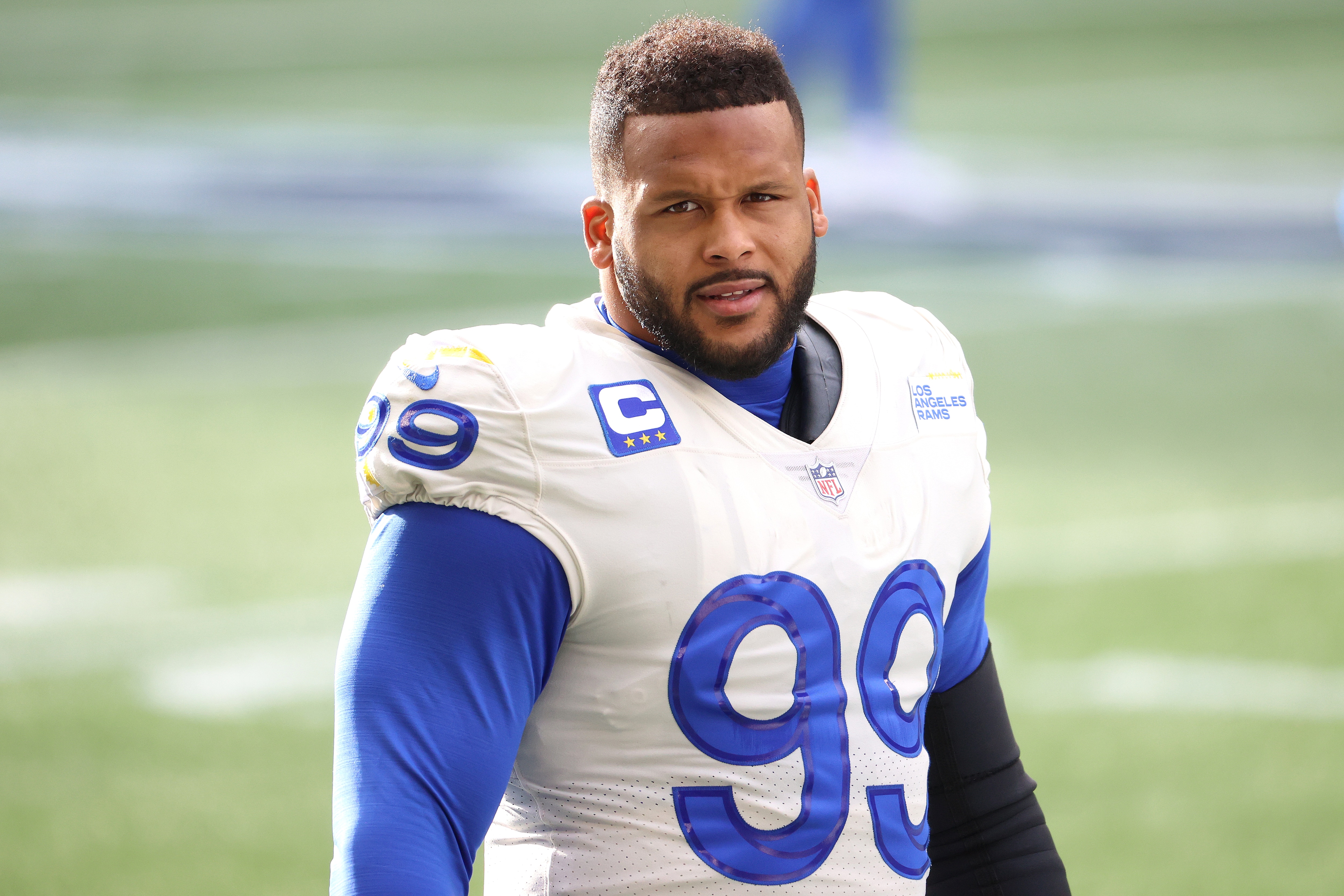 SEATTLE, WASHINGTON - JANUARY 09: Aaron Donald #99 of the Los Angeles Rams looks on the NFC Wild Card Playoff game against the Seattle Seahawks at Lumen Field on January 09, 2021 in Seattle, Washington. (Photo by Abbie Parr/Getty Images)