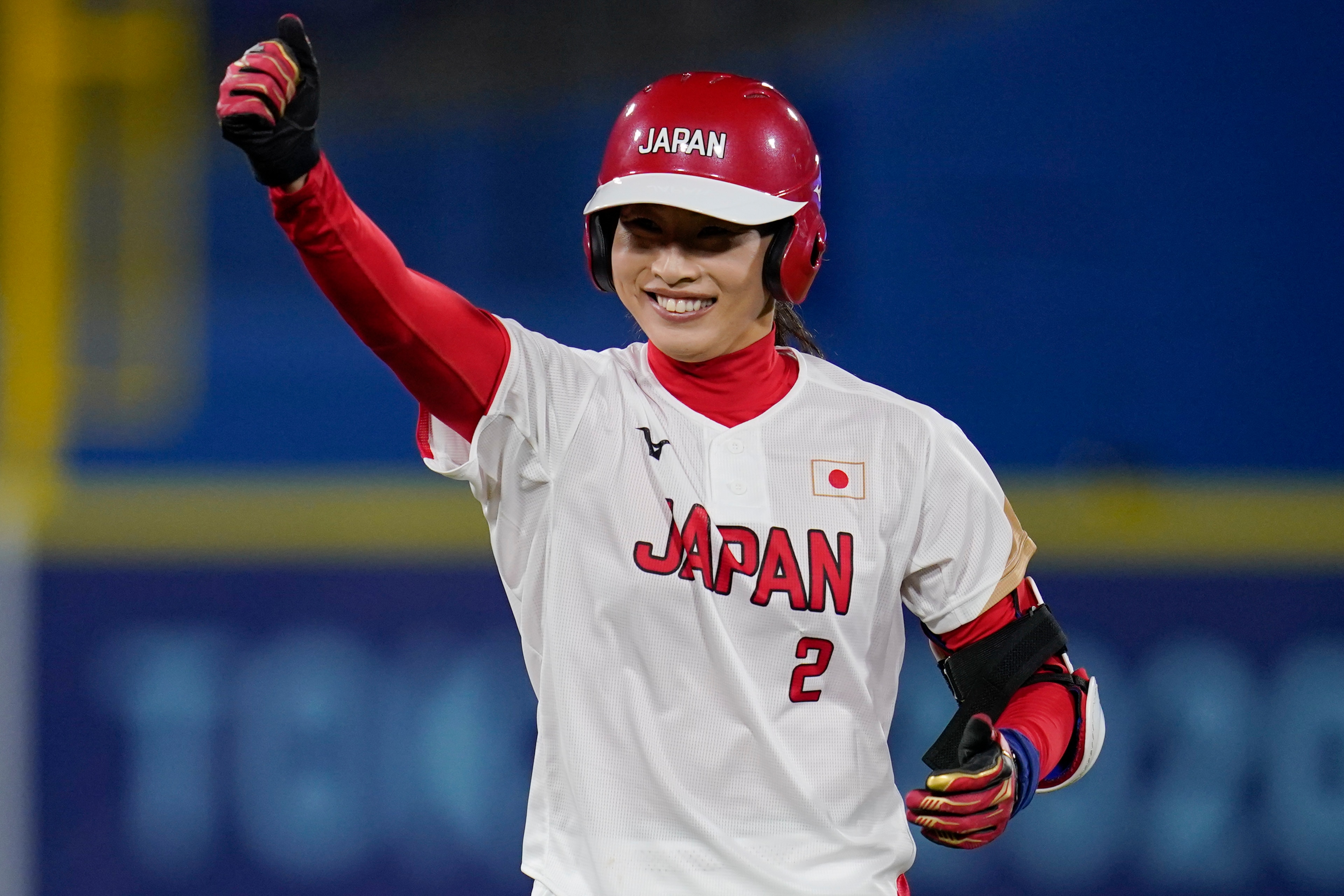 Japan's Saki Yamazaki reacts after hitting a double in the second inning of a softball game against the United States at the 2020 Summer Olympics, Tuesday, July 27, 2021, in Yokohama, Japan. (AP Photo/Sue Ogrocki) Japan's Saki Yamazaki reacts after hitting a double in the second inning of a softball game against the United States at the 2020 Summer Olympics, Tuesday, July 27, 2021, in Yokohama, Japan. (AP Photo/Sue Ogrocki)