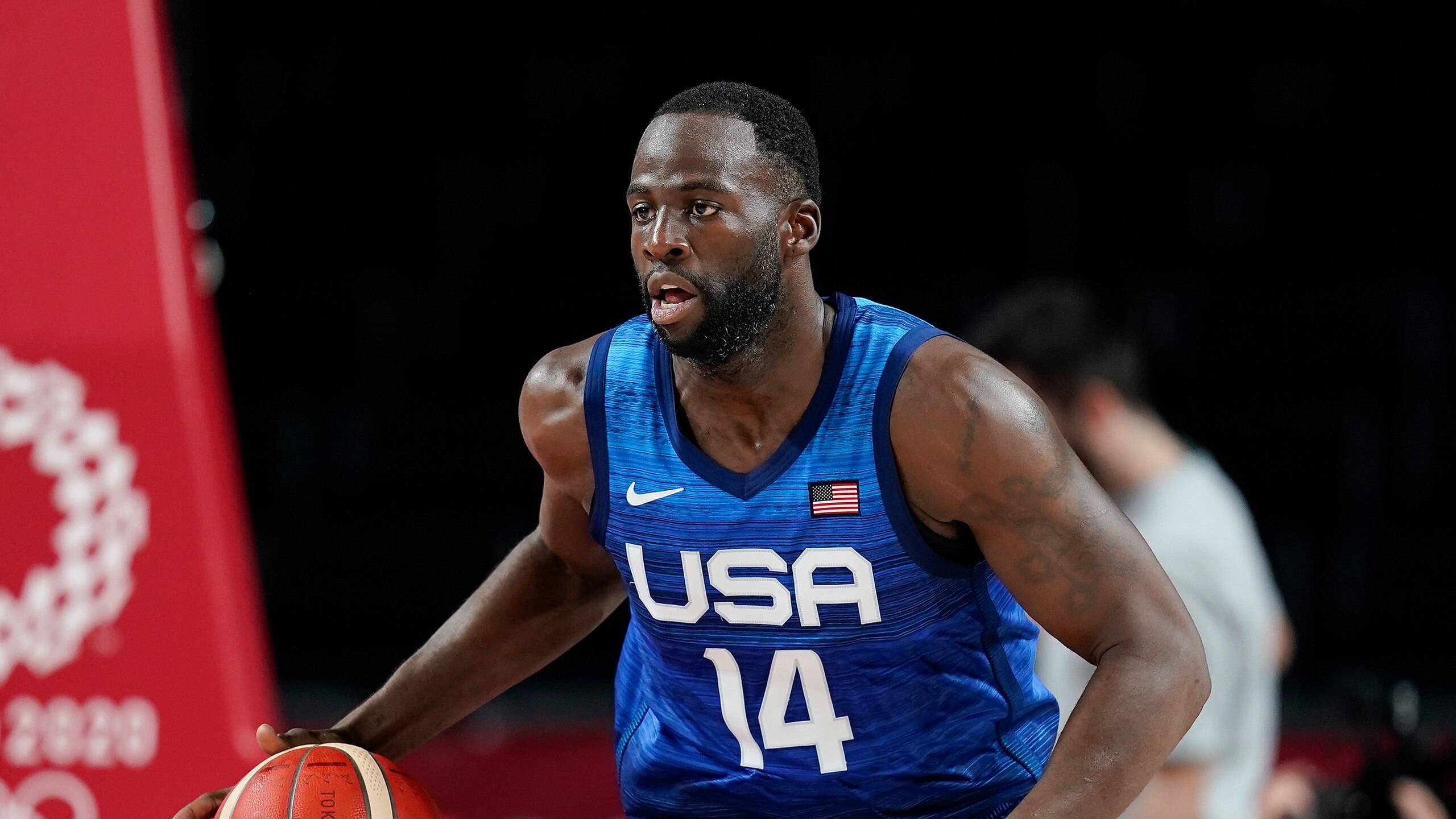 United States' Draymond Green drives up court during a men's basketball preliminary round game against France at the 2020 Summer Olympics, Sunday, July 25, 2021, in Saitama, Japan. (AP Photo/Charlie Neibergall)