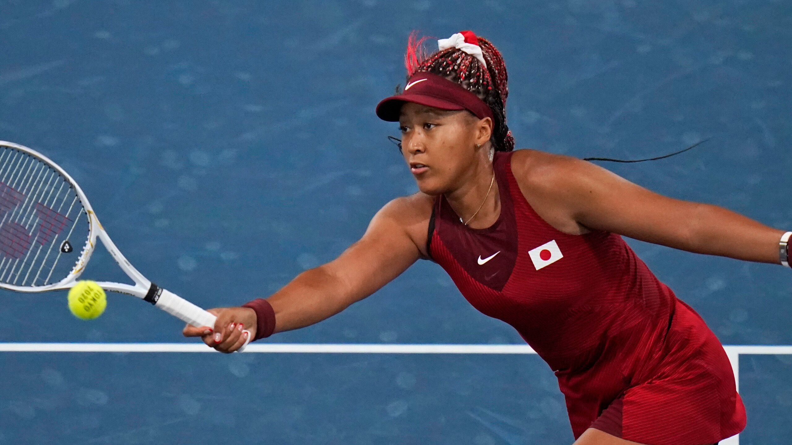 Naomi Osaka, of Japan, plays Marketa Vondrousova, of the Czech Republic, during the third round of the tennis competition at the 2020 Summer Olympics, Tuesday, July 27, 2021, in Tokyo, Japan. (AP Photo/Seth Wenig)