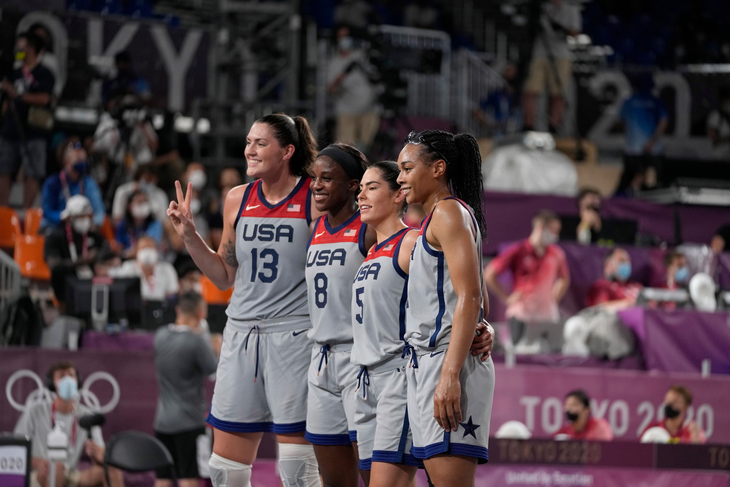 United States' Stefanie Dolson (13), Jacquelyn Young (8), Kelsey Plum (5) and Allisha Gray celebrate after defeating Russian Olympic Committee in a women's 3-on-3 gold medal basketball game at the 2020 Summer Olympics, Wednesday, July 28, 2021, in Tokyo, Japan. (AP Photo/Jeff Roberson)