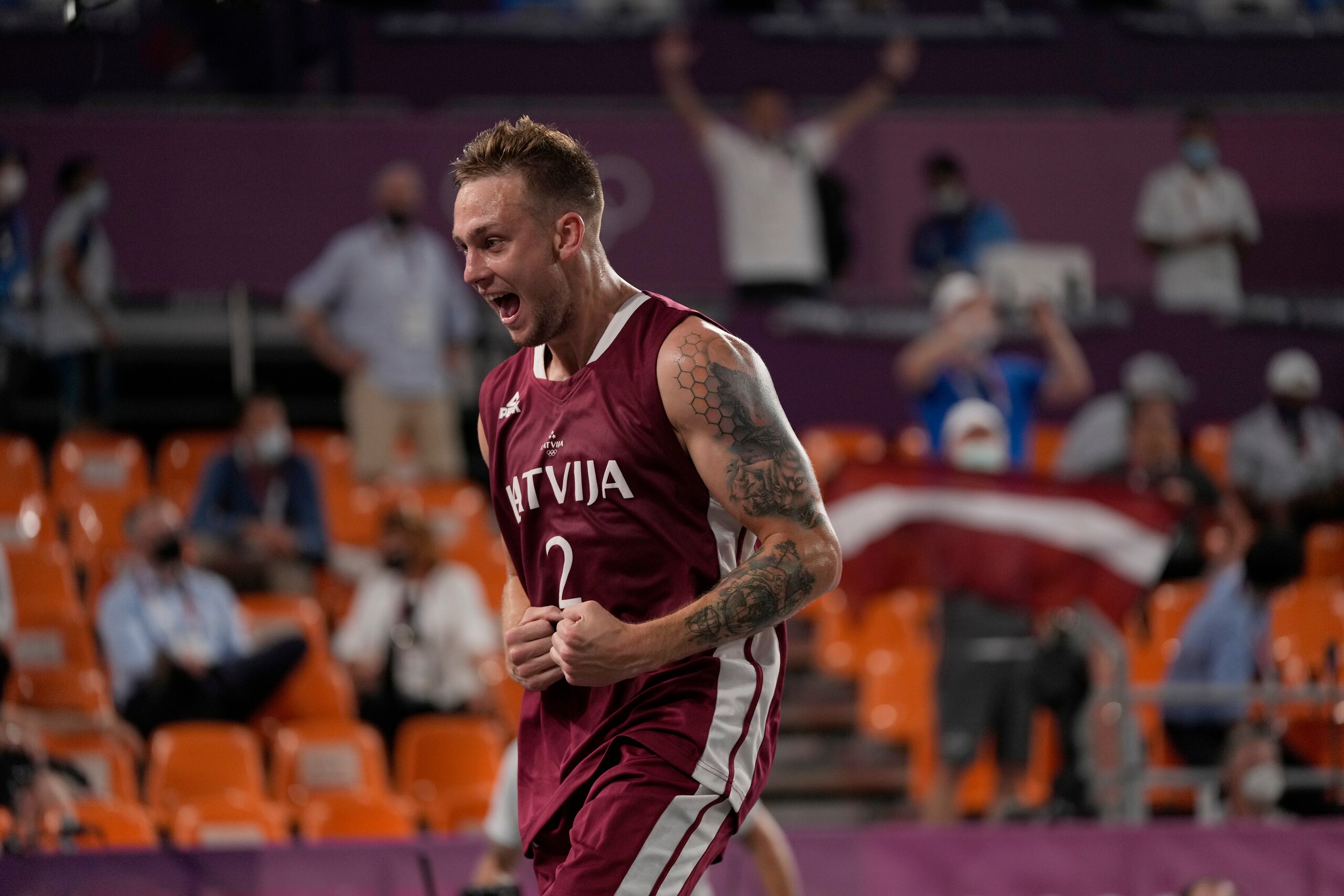 Latvia's Karlis Lasmanis (2) celebrates victory over Belgium following a men's 3-on-3 semifinal basketball game at the 2020 Summer Olympics, Wednesday, July 28, 2021, in Tokyo, Japan. (AP Photo/Jeff Roberson) Latvia's Karlis Lasmanis (2) celebrates victory over Belgium following a men's 3-on-3 semifinal basketball game at the 2020 Summer Olympics, Wednesday, July 28, 2021, in Tokyo, Japan. (AP Photo/Jeff Roberson)