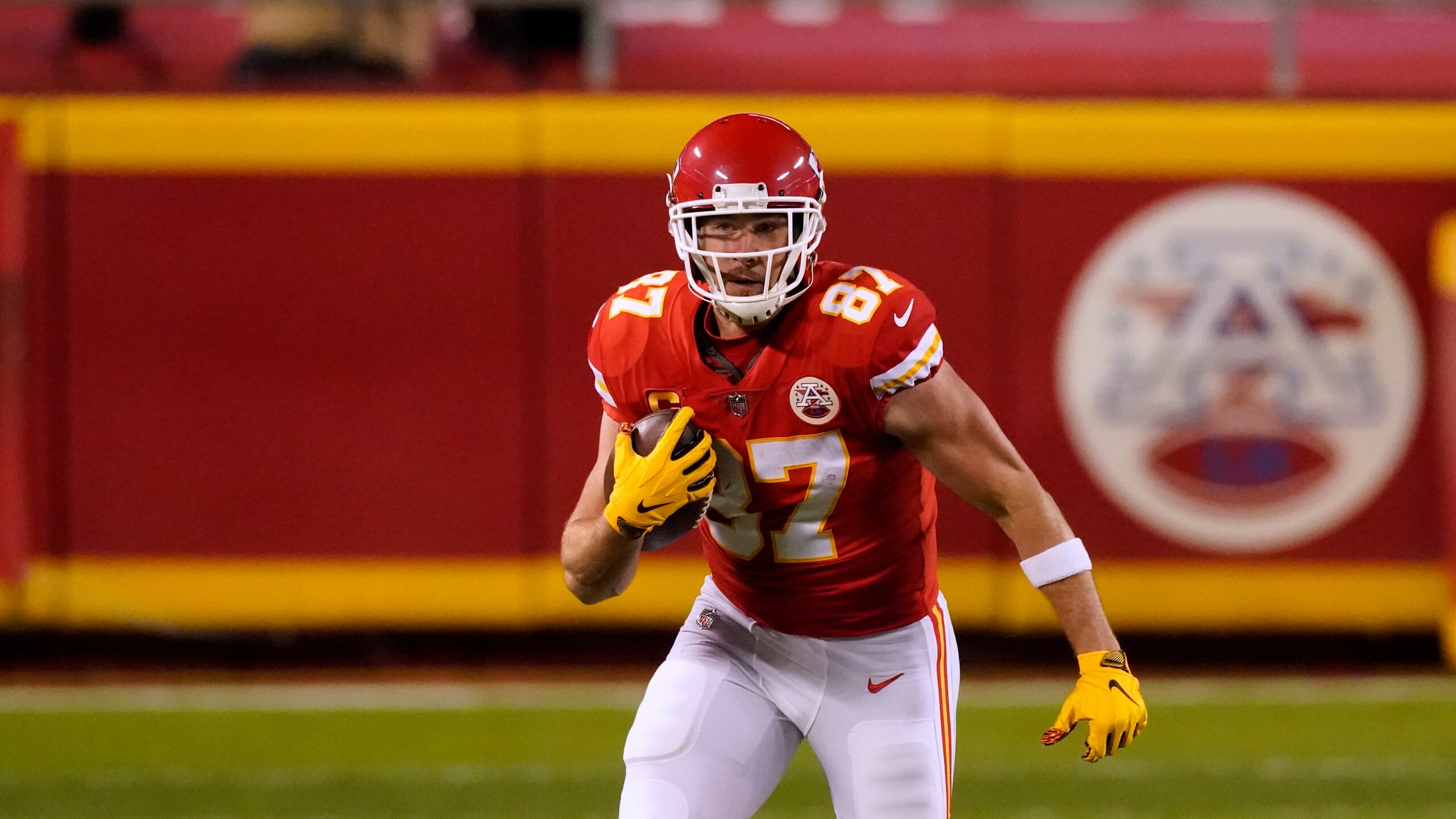 Kansas City Chiefs tight end Travis Kelce runs the ball during the first half of the AFC championship NFL football game against the Buffalo Bills Sunday, Jan. 24, 2021, in Kansas City, Mo. (AP Photo/Charlie Riedel)