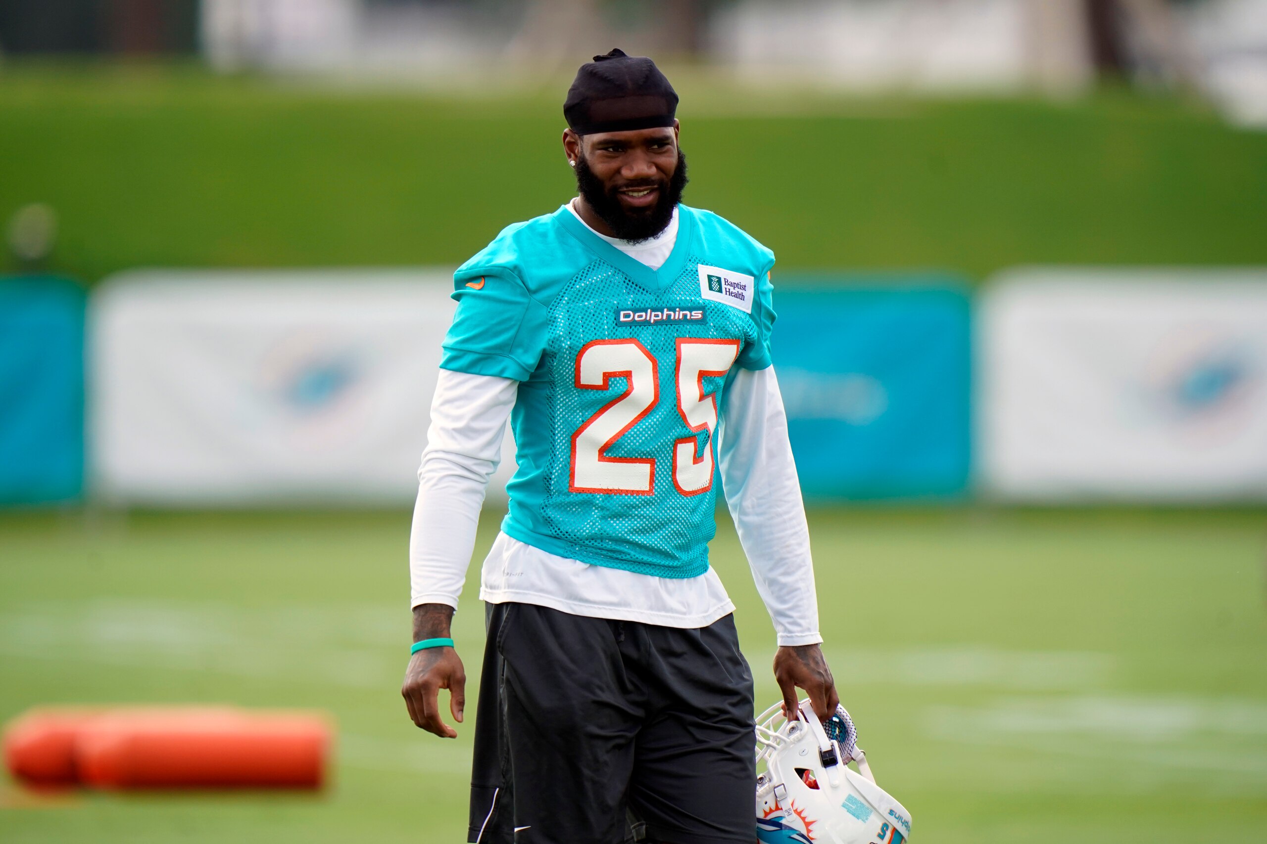 Miami Dolphins cornerback Xavien Howard prepares to warm up during NFL football practice, Wednesday, July 28, 2021, in Miami Gardens, Fla. (AP Photo/Wilfredo Lee)