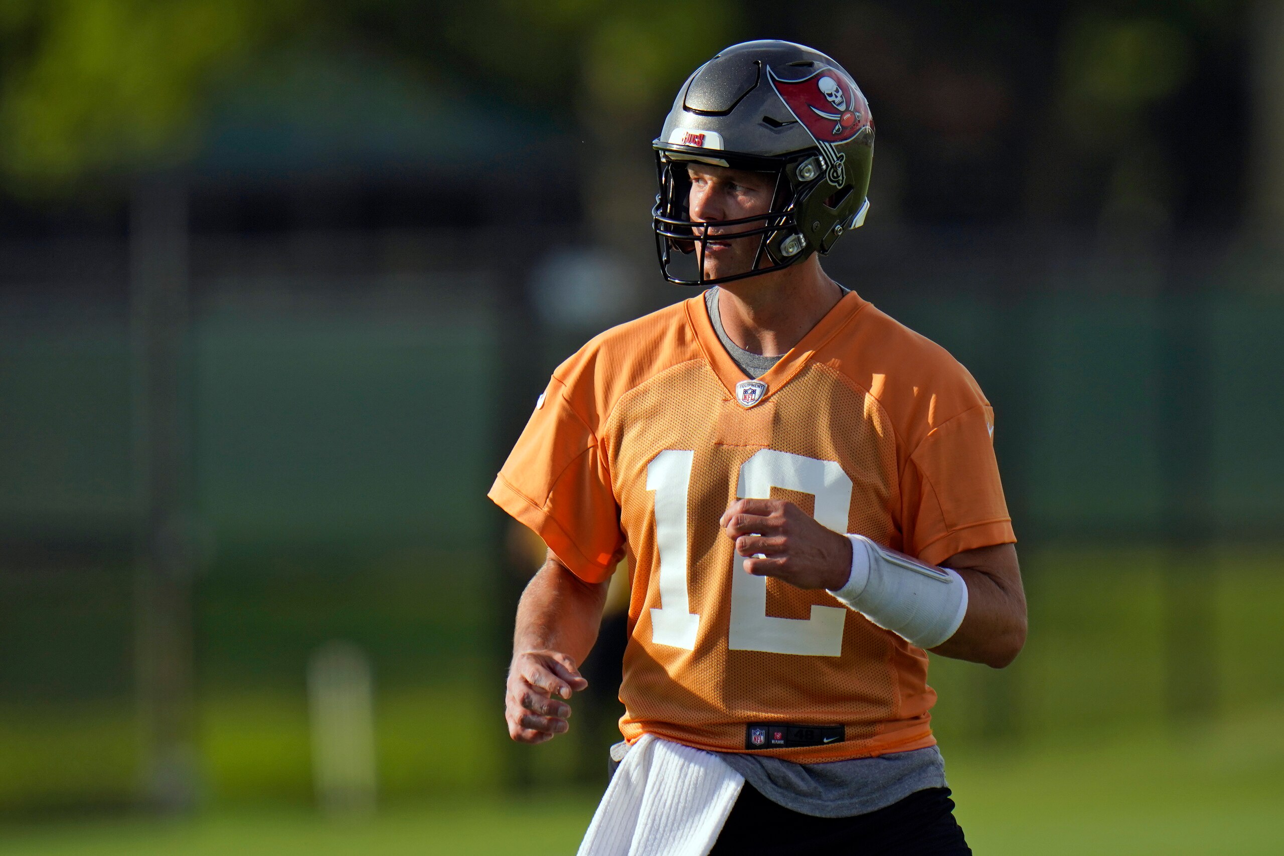 Tampa Bay Buccaneers quarterback Tom Brady (12) runs during an NFL football practice Tuesday, July 27, 2021, in Tampa, Fla. (AP Photo/Chris O'Meara) Tampa Bay Buccaneers quarterback Tom Brady (12) runs during an NFL football practice Tuesday, July 27, 2021, in Tampa, Fla. (AP Photo/Chris O'Meara)