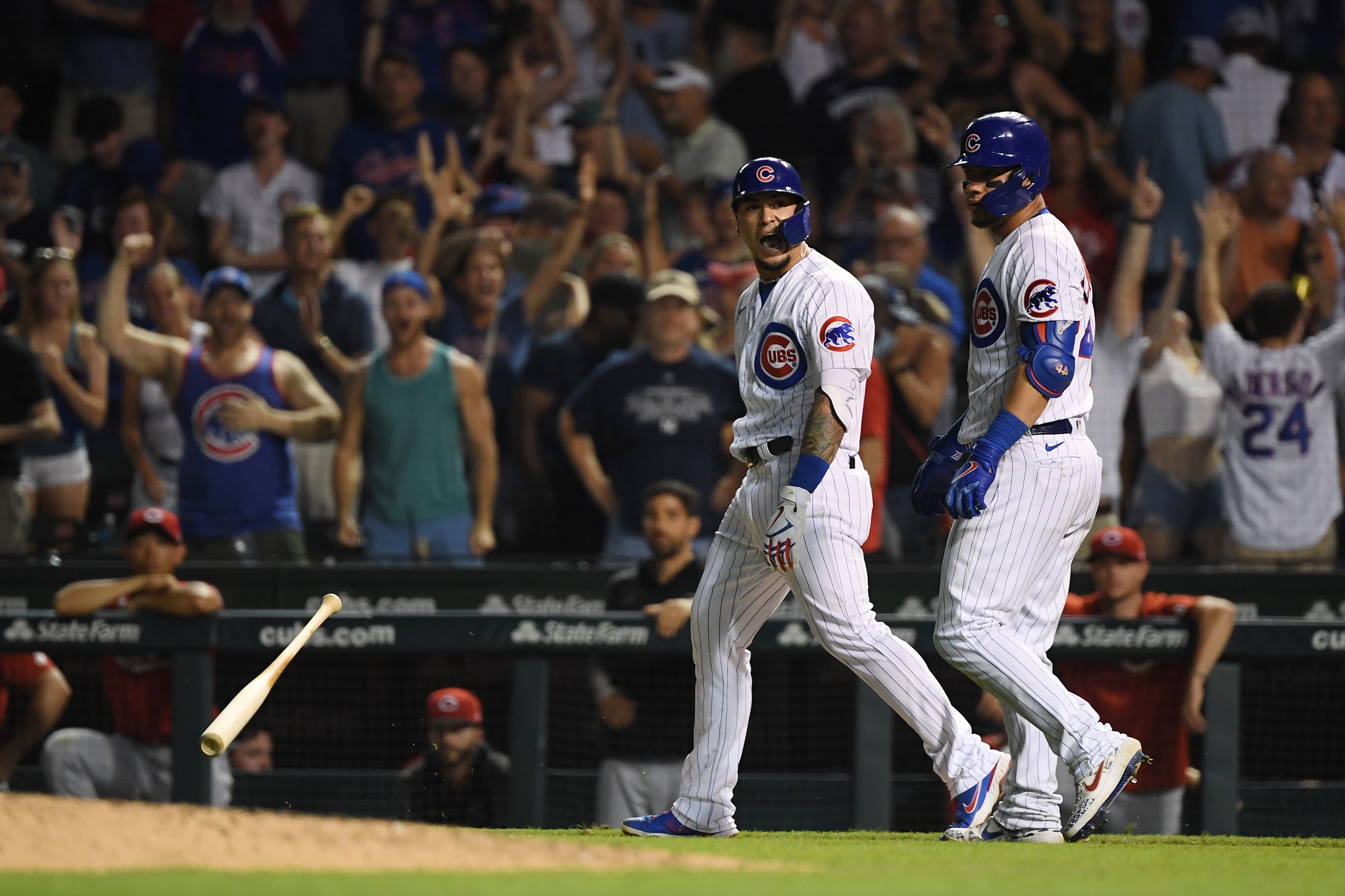 CHICAGO, ILLINOIS - JULY 26: Javier Baez #9 of the Chicago Cubs reacts after his walk off single in the ninth inning against the Cincinnati Reds at Wrigley Field on July 26, 2021 in Chicago, Illinois. (Photo by Quinn Harris/Getty Images)