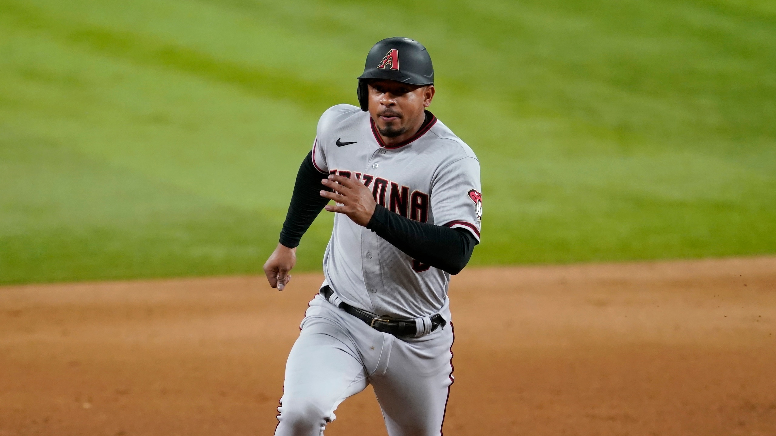 Arizona Diamondbacks' Eduardo Escobar saints to third during a baseball game against the Texas Rangers in Arlington, Texas, Tuesday, July 27, 2021. (AP Photo/Tony Gutierrez)