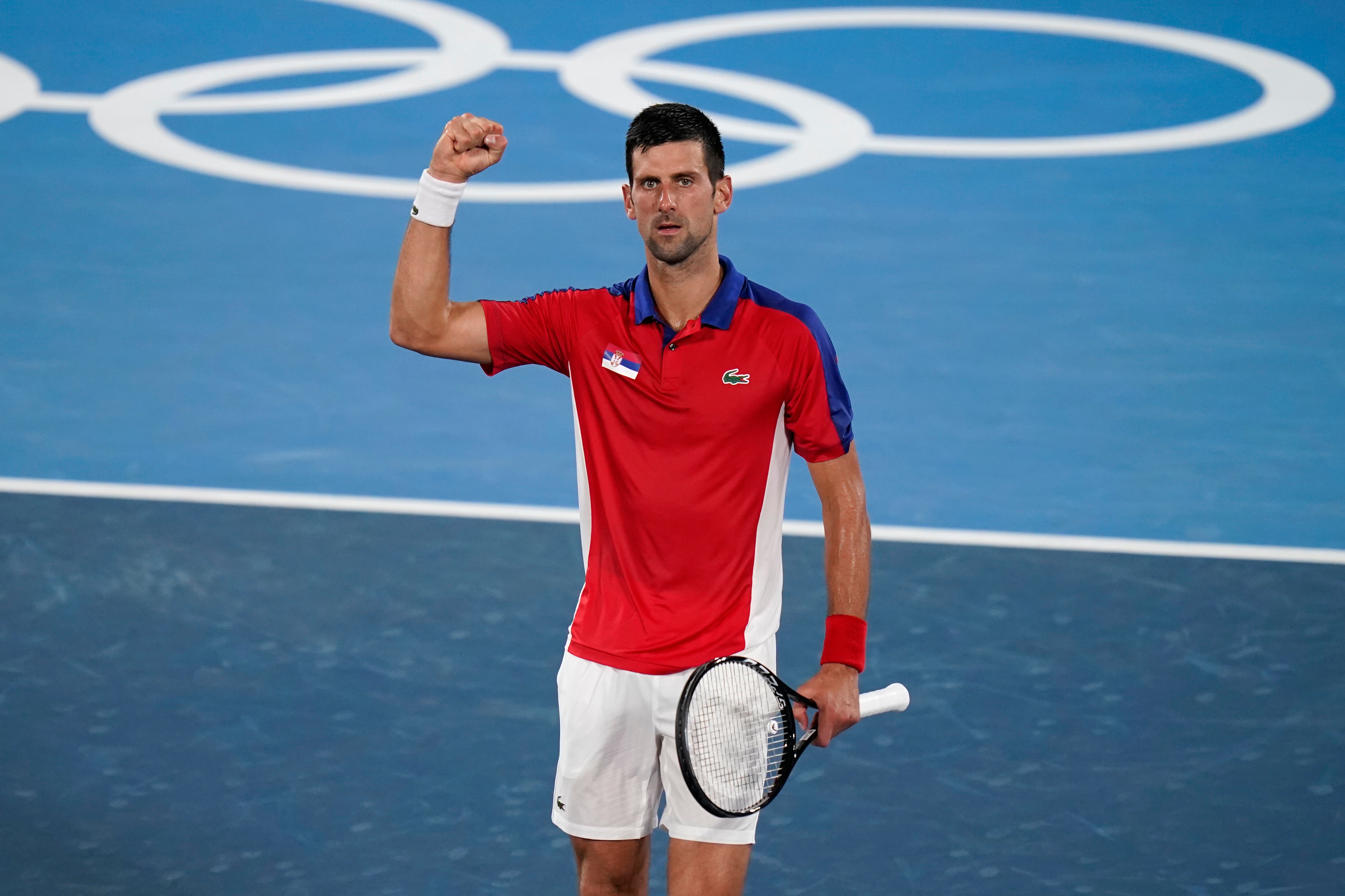 Novak Djokovic, of Serbia, celebrates after defeating Kei Nishikori, of Japan, during the quarterfinals of the tennis competition at the 2020 Summer Olympics, Thursday, July 29, 2021, in Tokyo, Japan. (AP Photo/Seth Wenig)